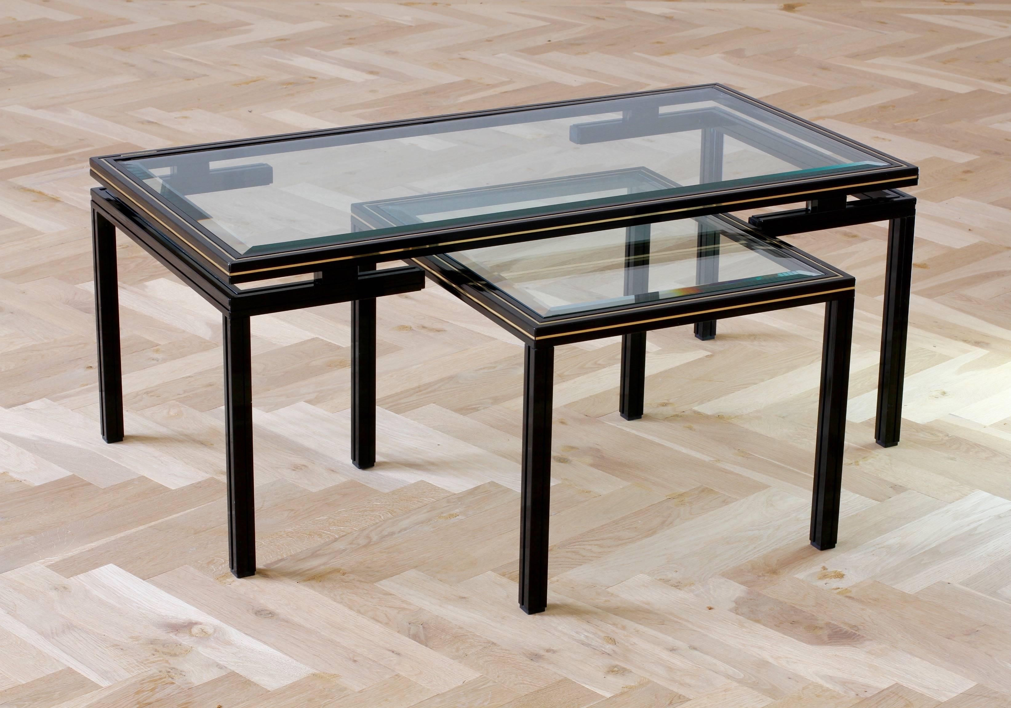 Stunning pair of Pierre Vandel tables featuring a combination of coffee table with side table which cleverly stores under the larger table. The frames are made of black powder coated aluminium/aluminum, making them light whilst extremely strong and