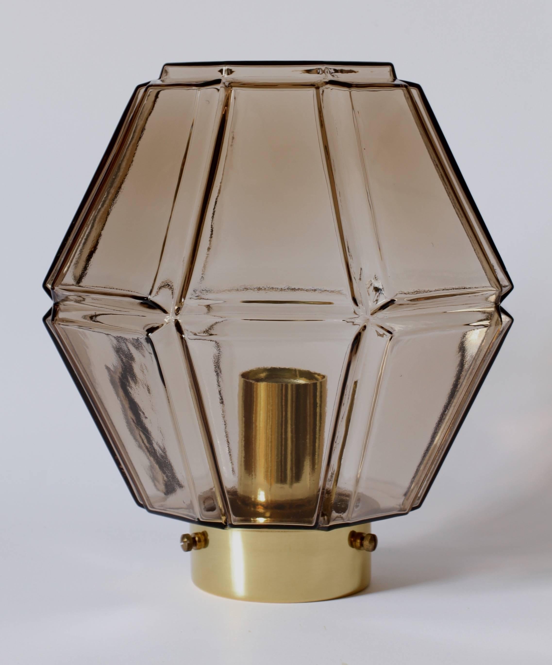One of a pair of wonderful German light fixtures by Glashütte Limburg, circa 1965-1975. The geometric octagonal form illuminates beautifully and suggests something almost more Art Deco in style and design although it is firmly a Mid-Century