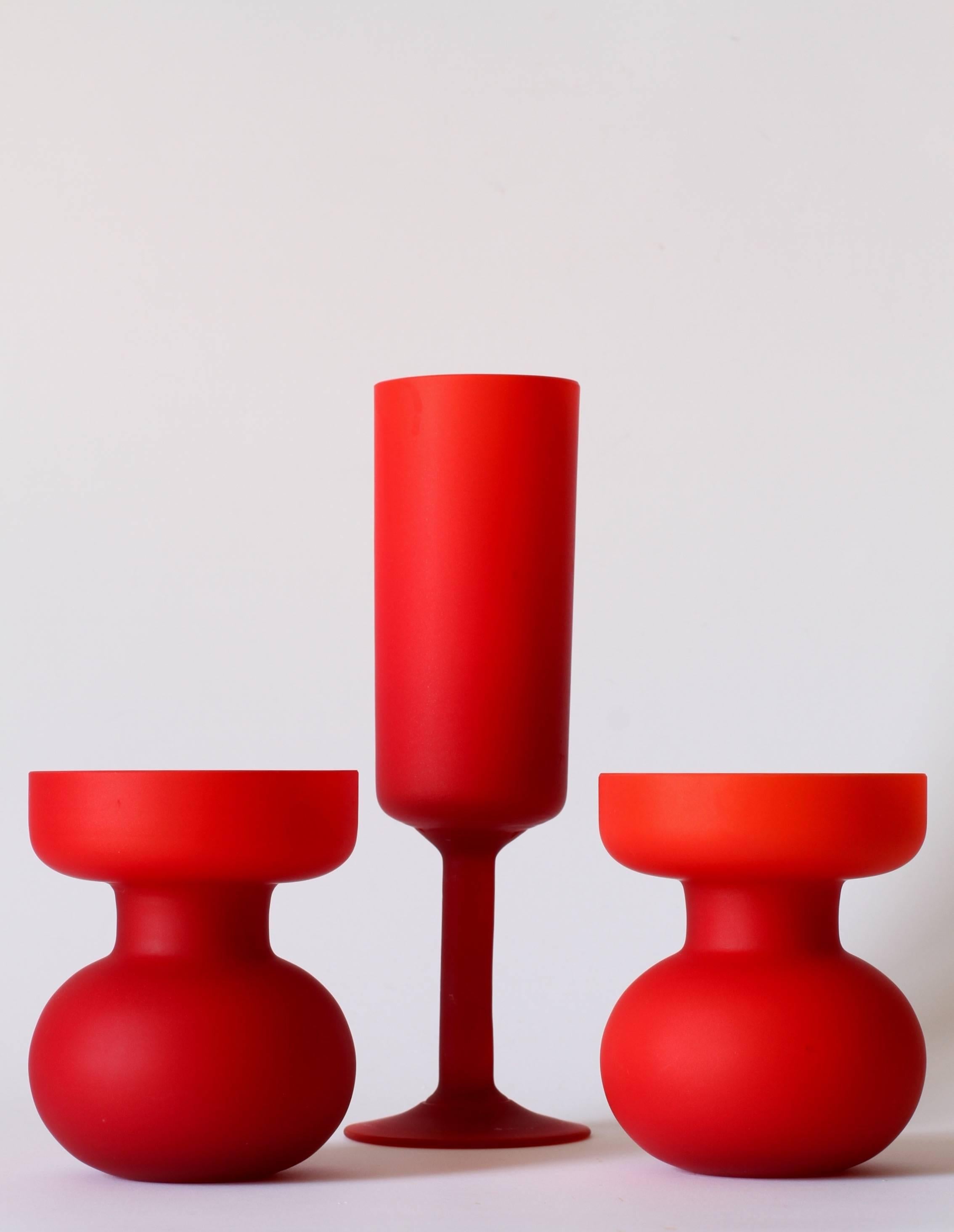 Vibrant set of three vases and vessels by Carlo Moretti, circa 1970. The set includes two small round vases perfect for growing hyacinths and a single goblet or vase. This is a perfect example of Moretti's best work with, not only, the beautiful