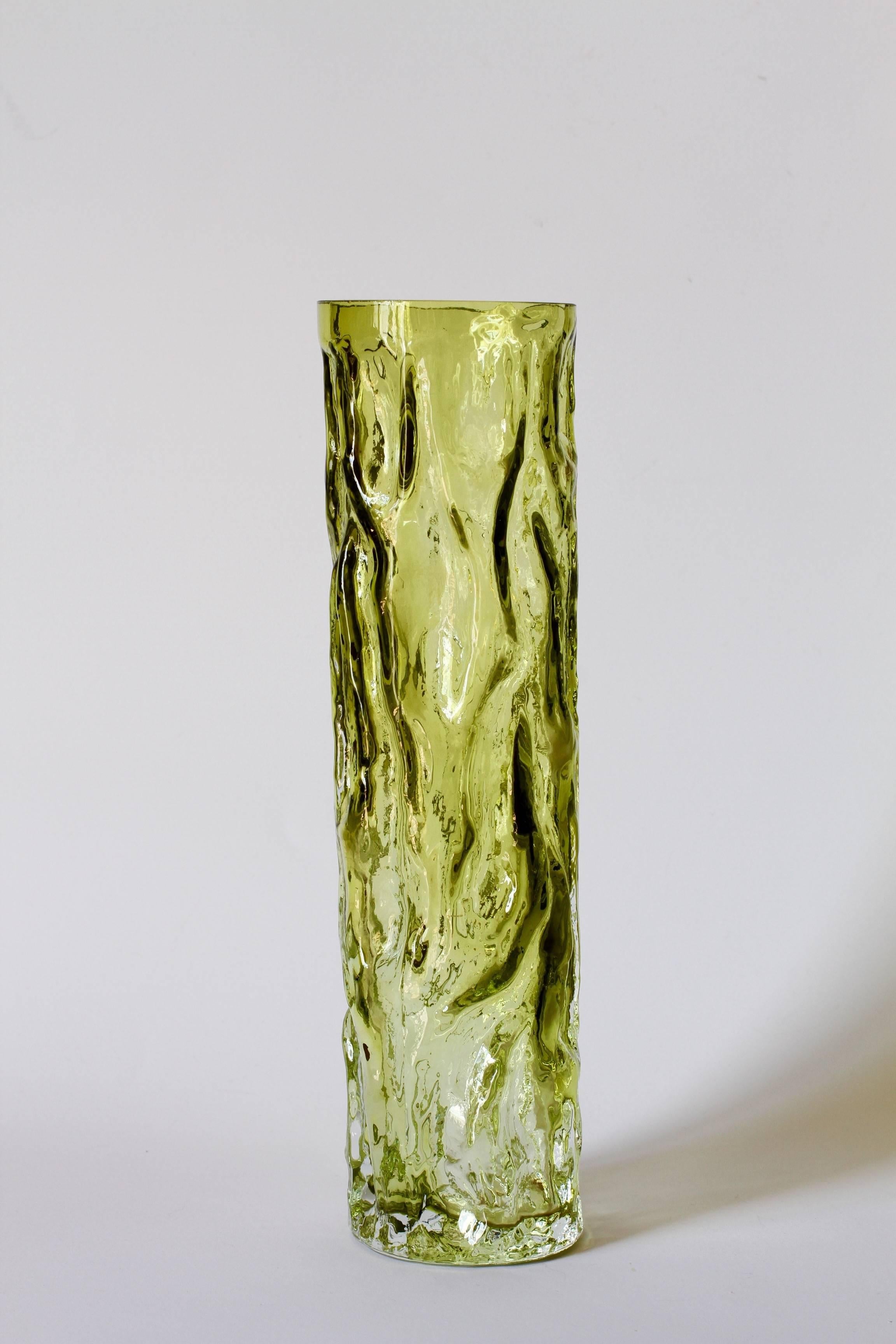 Wonderful and tall Mid-Century Modern German vase by Ingrid Glas, circa 1970. This beautiful vase brings a touch of fun and fantasy to any room with it's whimsical 'tree bark' form captured in moss green coloured / colored mouth blown molded