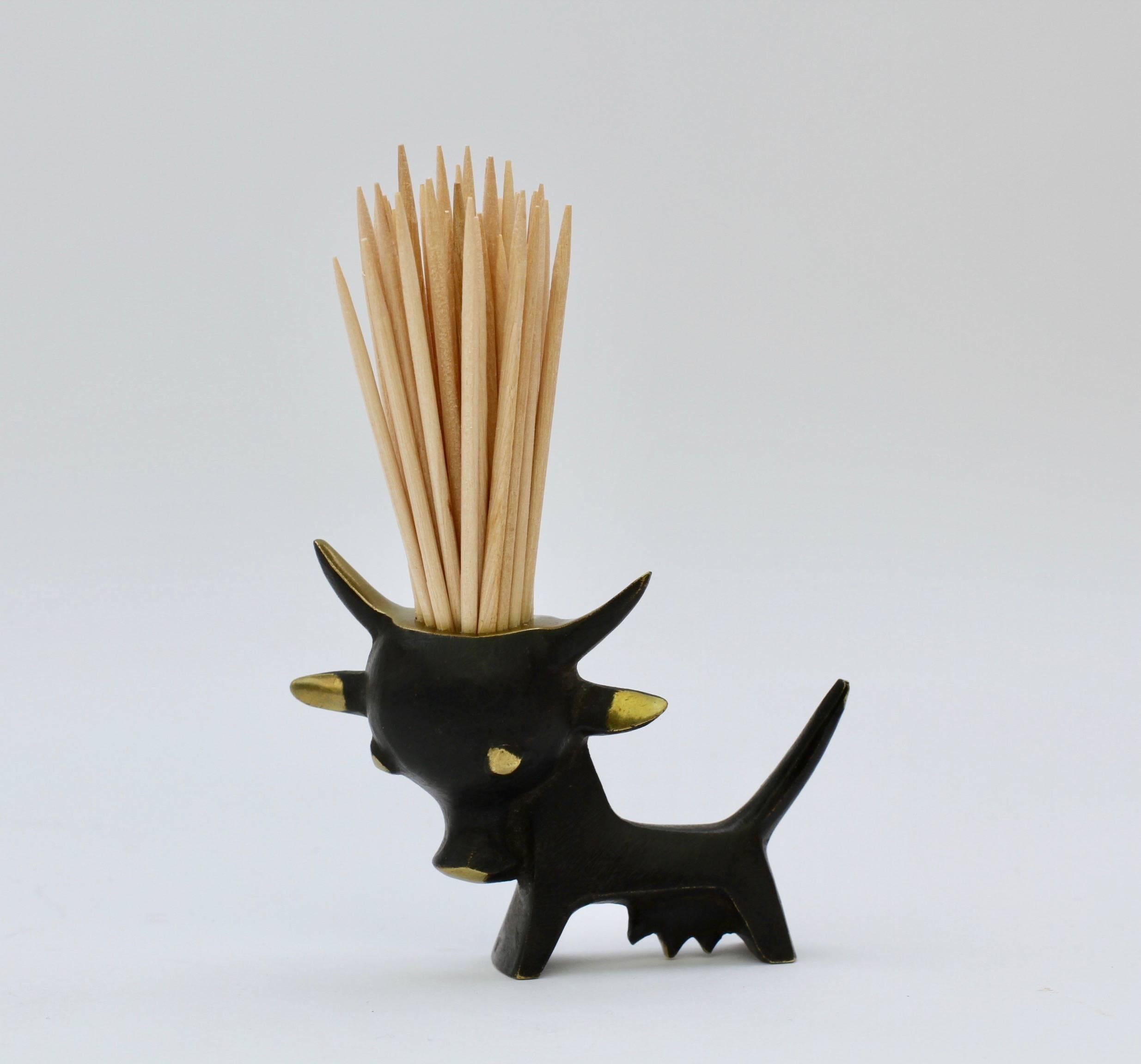 A Walter Bosse toothpick holder in the form of a cow or bull.

Walter Bosse's whimsical and playful designs have one the hearts of many a design fan/collector as they are perfectly practical and joyfully jest full. Bring back your inner child and