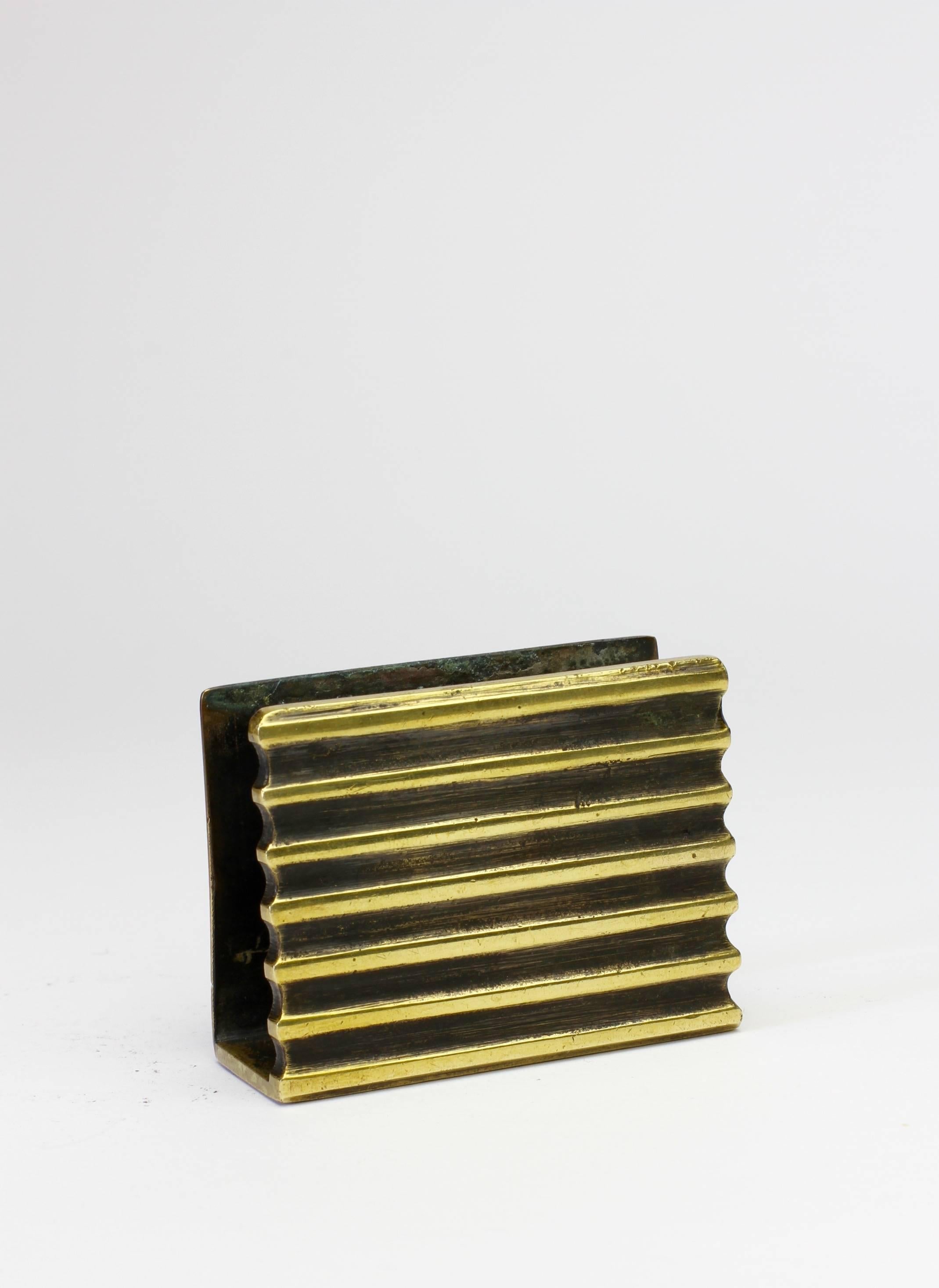 A rare 1950s brass matchbox holder by Austrian born designer Walter Bosse, circa 1954.

Perfect for the gentleman or lady smoker and could also be used to accessorise your desk as a business card holder.

Complete set available, as shown in the last