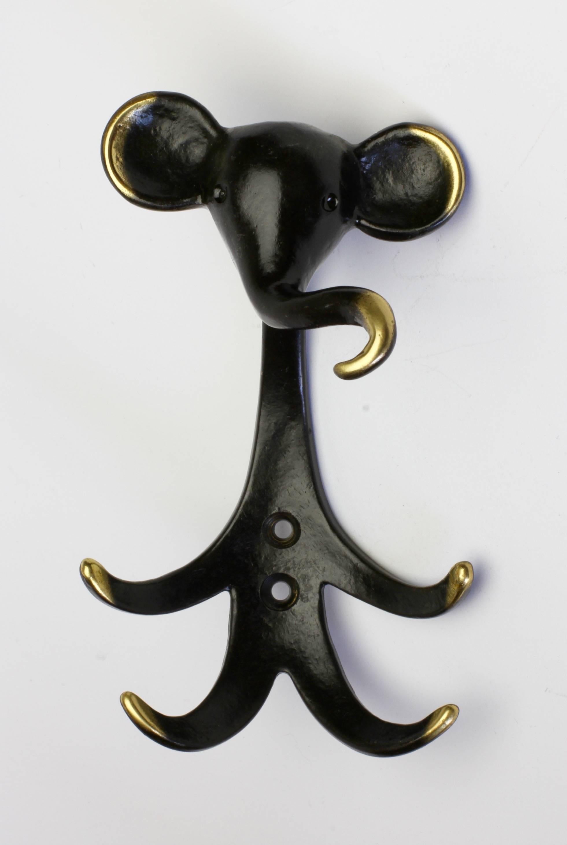 A Walter Bosse hook in the form of an elephant. What better way is there to bring some joy into a room than with a fabulous brass wall hook by Walter Bosse. Whether a hallway, bathroom of children's bedroom or playroom, this delightful hook is
