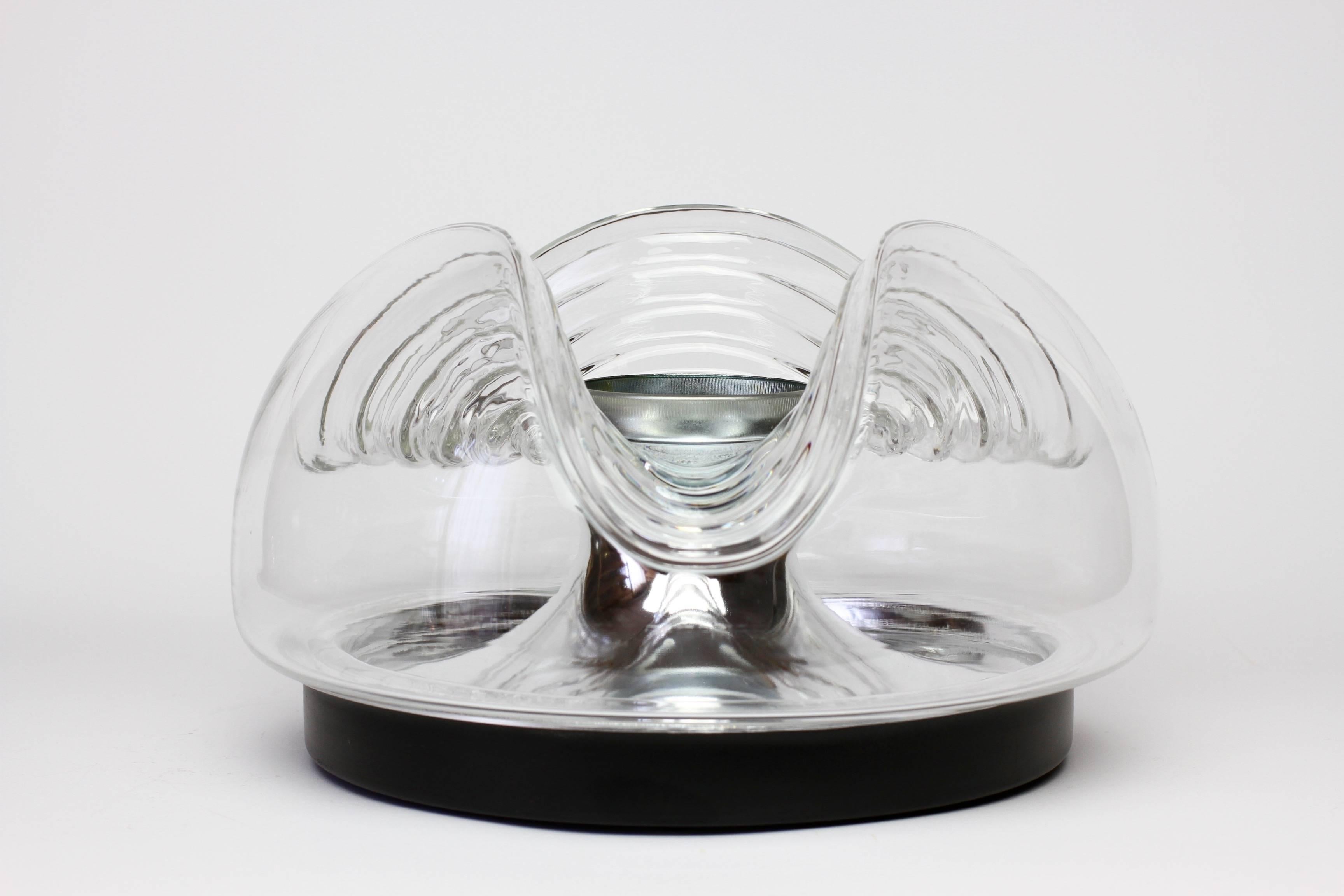 Absolutely wonderful and fun small pair of wall lights or sconces perfect for small niche or over a vanity mirror. Designed by Koch & Lowy for German lighting company Peill & Putzler, circa 1970-1975. These Futuristic pair of wall lights are a