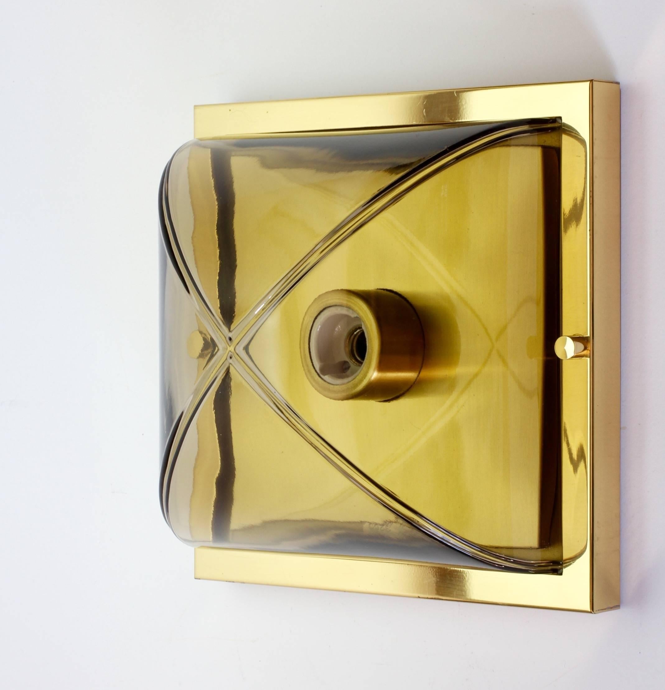 A fantastic, vintage and Minimalist German made wall or ceiling flush mount light fixture - perfect for over a vanity mirror - by Glashütte Limburg, circa 1970s / 1980s. The simple, yet striking, clean lined modernist design looks timeless and would