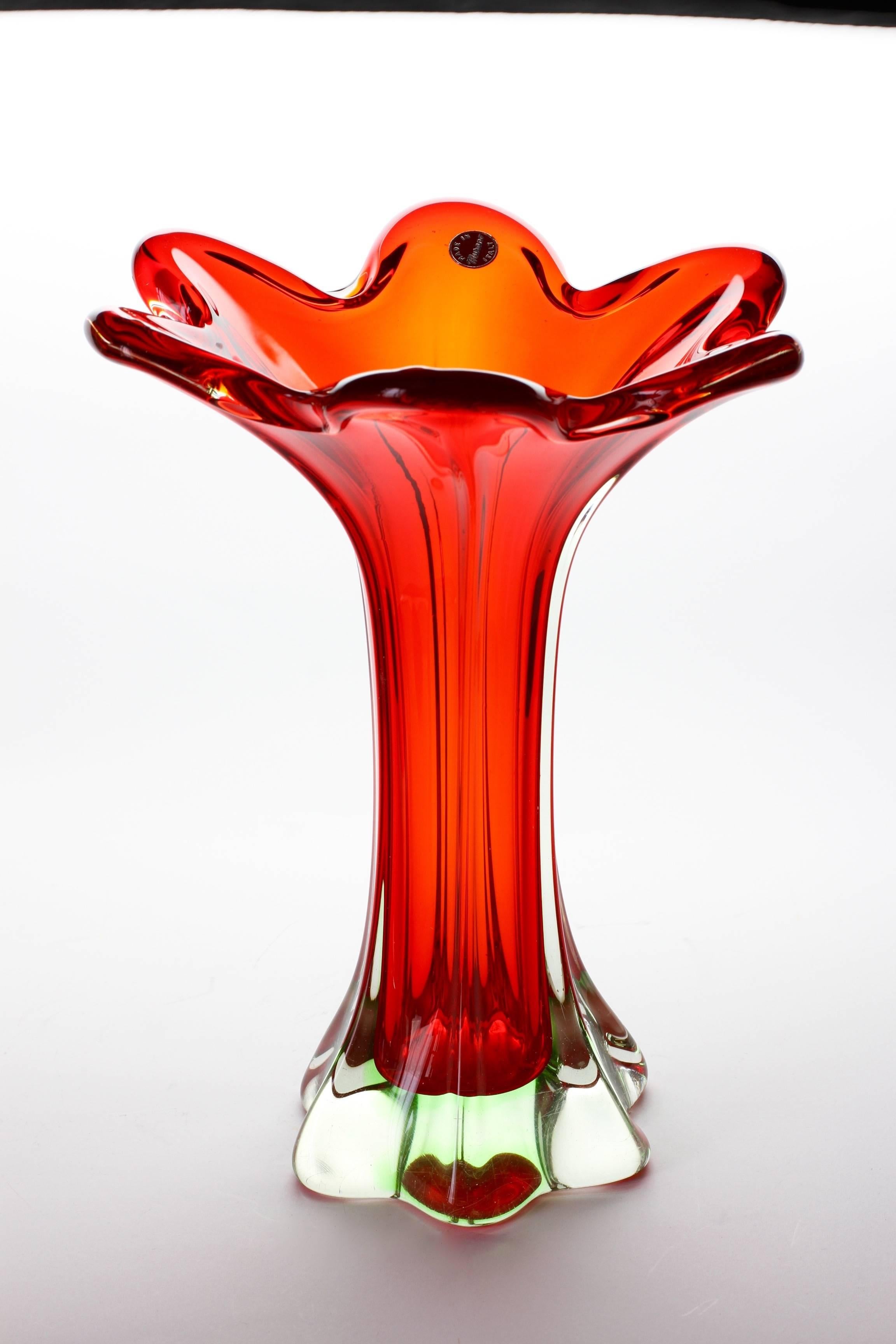 A wonderful tall Murano vase of red and green sommerso glass. This piece is huge at almost twelve inches tall. A wonderful statement piece and would look exceptional as a centrepiece filled with beautiful flowers or on display on a shelf or in a