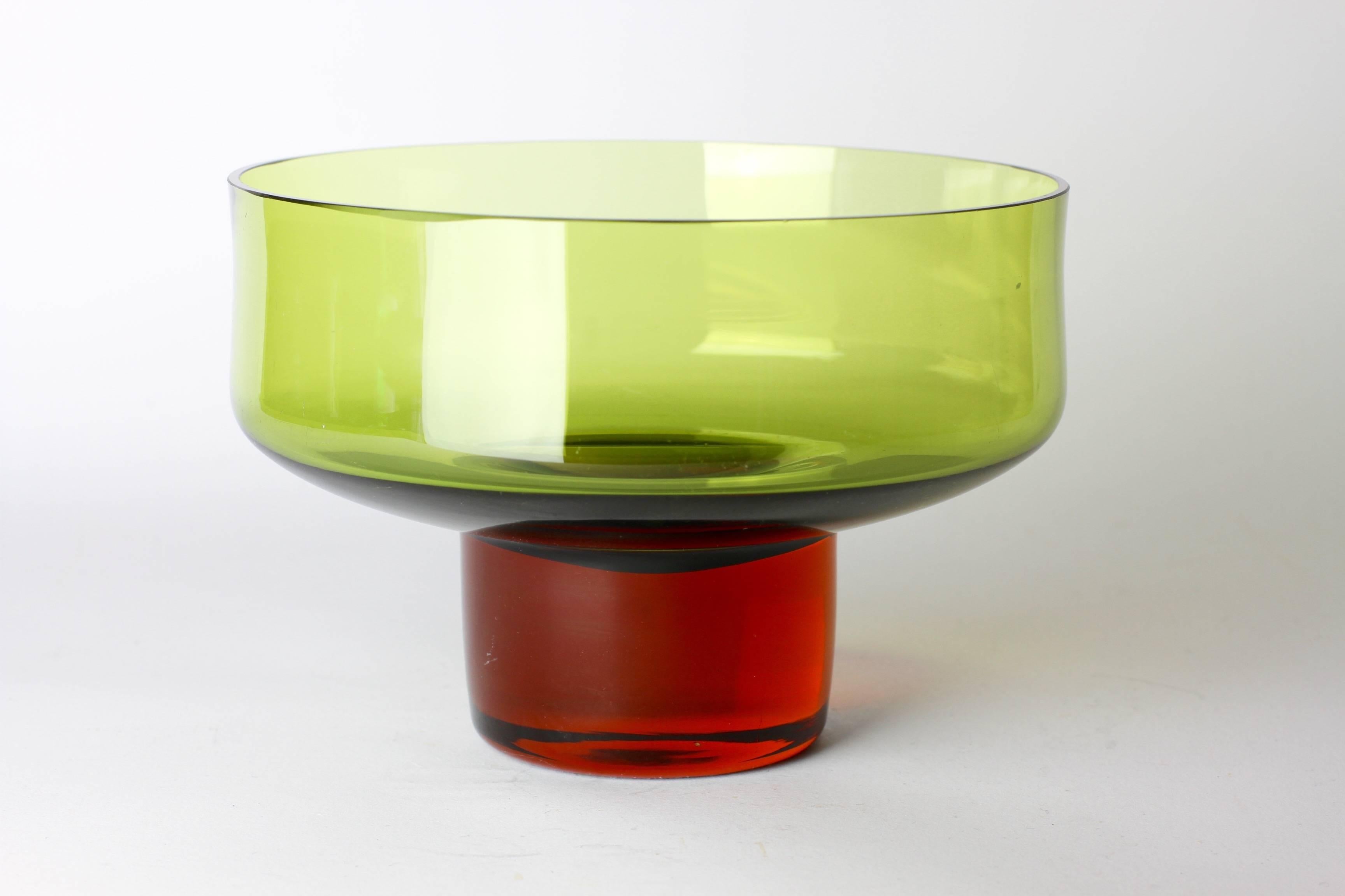Beautiful green and amber toned glass bowl or dish designed by Bo Borgström for Aseda Glasbruk, Sweden. The thin, delicate green wall of the bowl, coupled with the thick, heavy amber base, gives this Scandinavian bowl it's delightful charm.

Model
