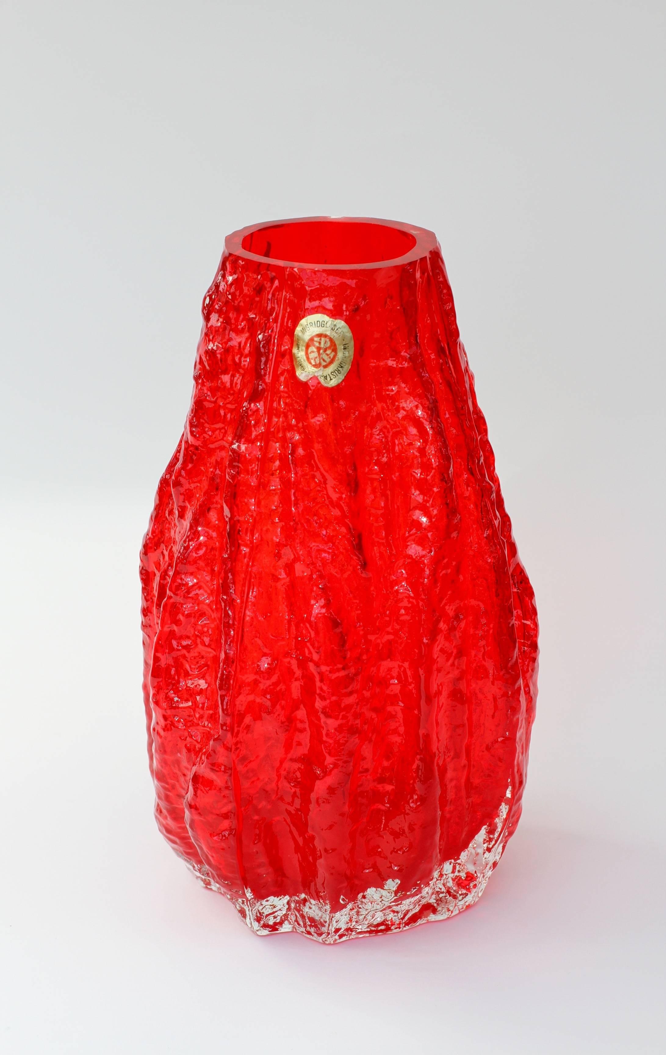 Wonderful Mid-Century Modern German vase by Ingrid Glas, circa 1970. This beautiful bright red vase brings a touch of fun and fantasy to any room with it's whimsical textured 'tree bark' form captured in vivid, vibrant red coloured / colored mouth