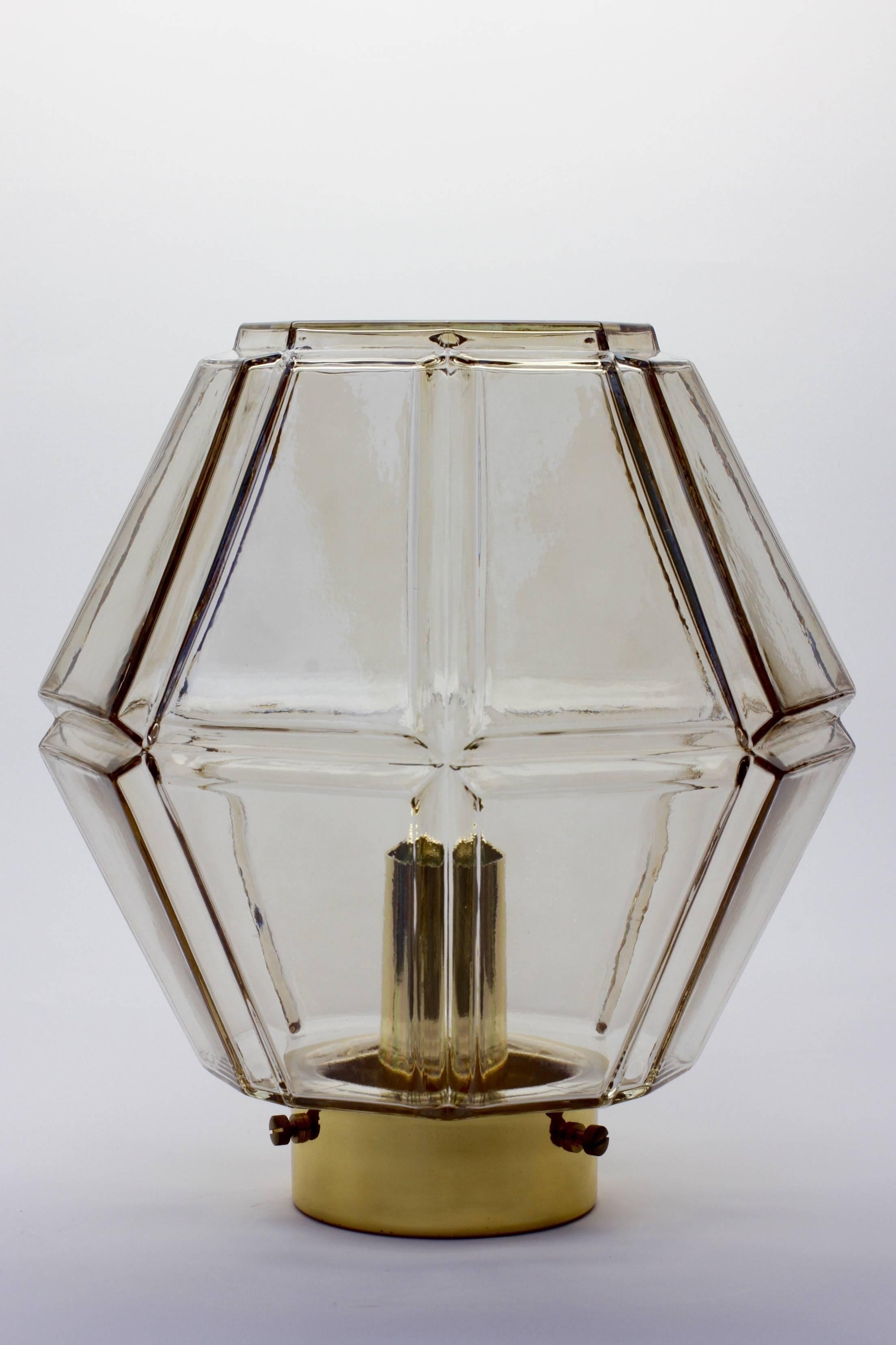 One of a set of four wonderful German light fixtures by Glashütte Limburg, circa 1975-1985. The geometric octagonal form illuminates beautifully and suggests something almost more Art Deco in style and design although it is firmly a late midcentury