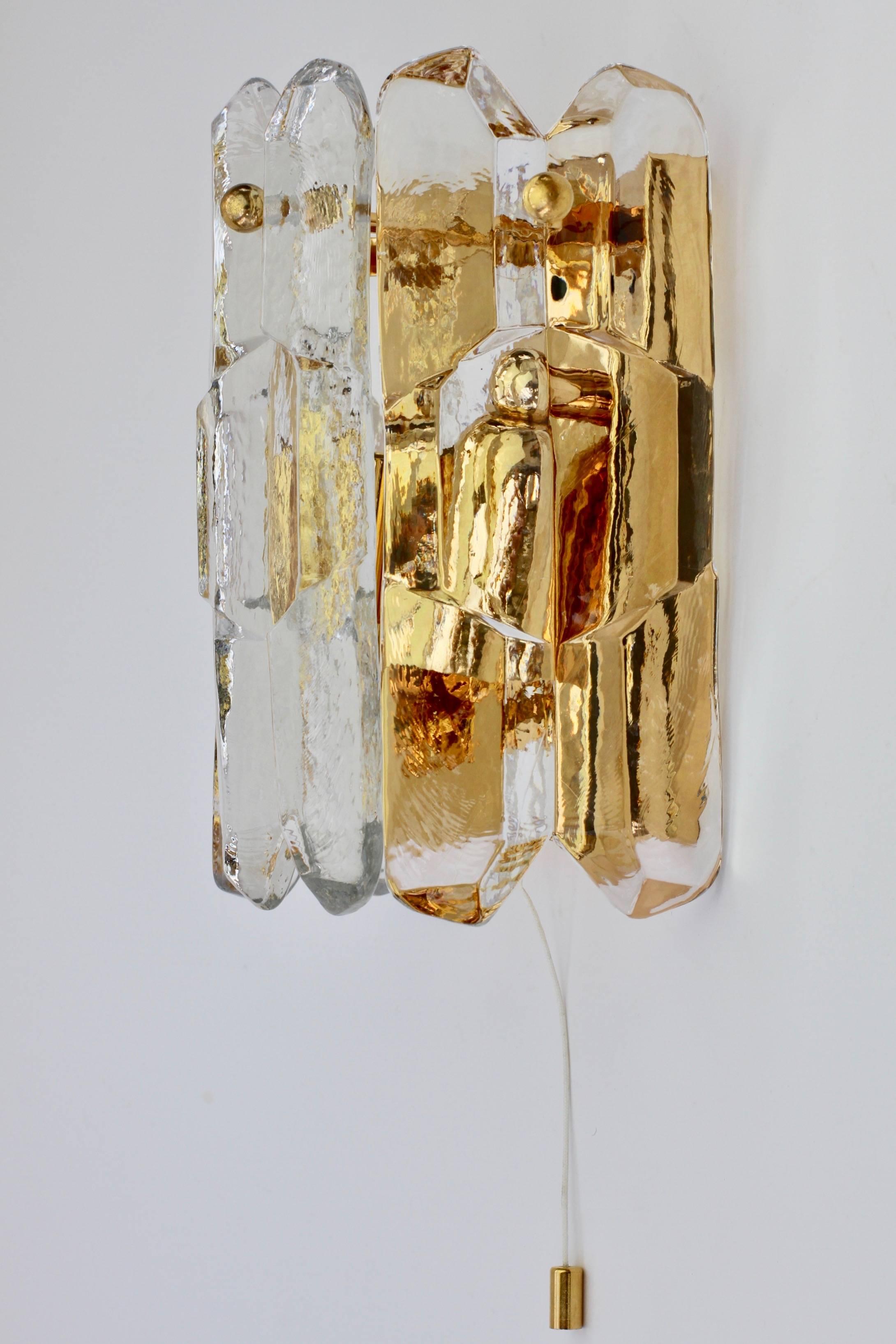 Exceptionally rare, 'new old stock' Austrian made 'Palazzo' ice crystal glass wall sconce or lamp by Kalmar, circa 1960. Featuring three hanging glass elements resembling melting ice crystals suspended from a 24-carat gold-plated brass mount or
