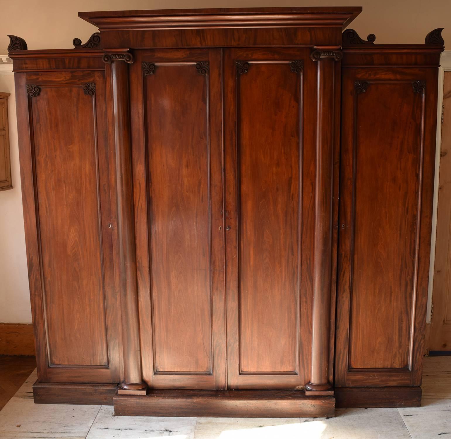 
An exceptional William IV four door mahogany wardrobe or armoire.

Fabulous colour. The patina is original, it has not been re-polished.

Superb architectural details in the Greek style including the splendid Ionic columns.

It is made of