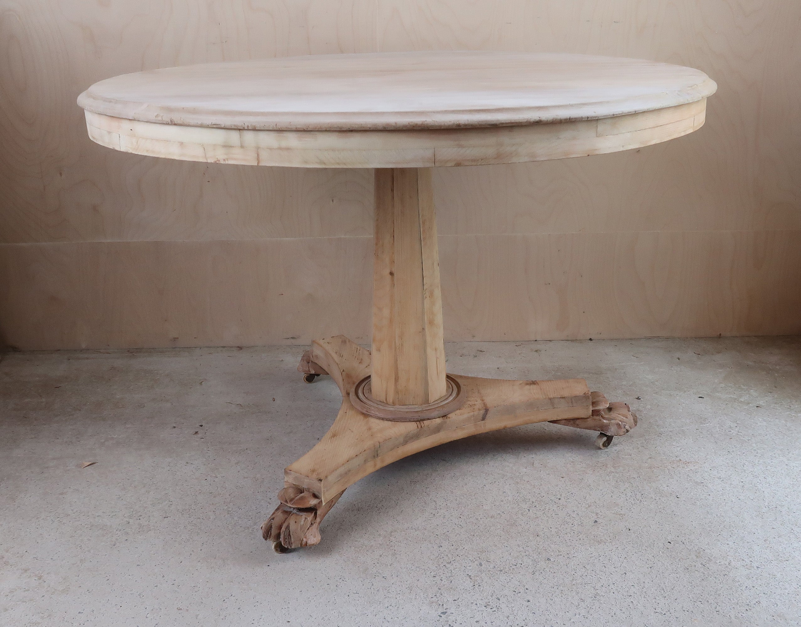 Fabulous small round table. Made from bleached tropical hardwood and pine

Lions paw feet

I particularly like its simplicity.

I have chosen not to lacquer or wax the table.

Original pot castors

For more economical overseas shipping the base will