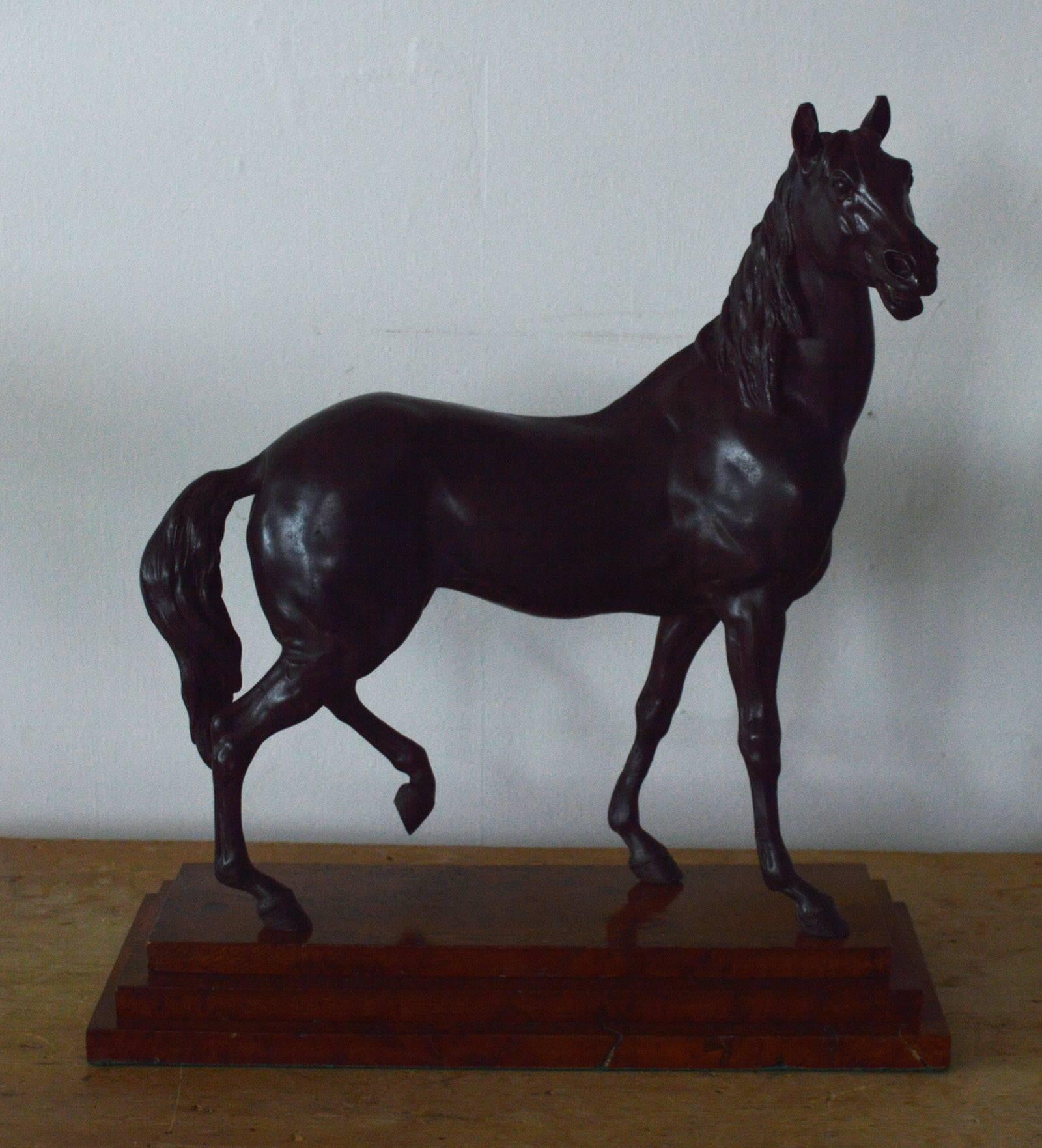 
Wonderful sculpture of a horse in classical style.

Cast in spelter and hand-colored to imitate bronze.

French, late 19th century. Unsigned.

The base is made of pollard or burl oak which has been highly polished to imitate marble.

The