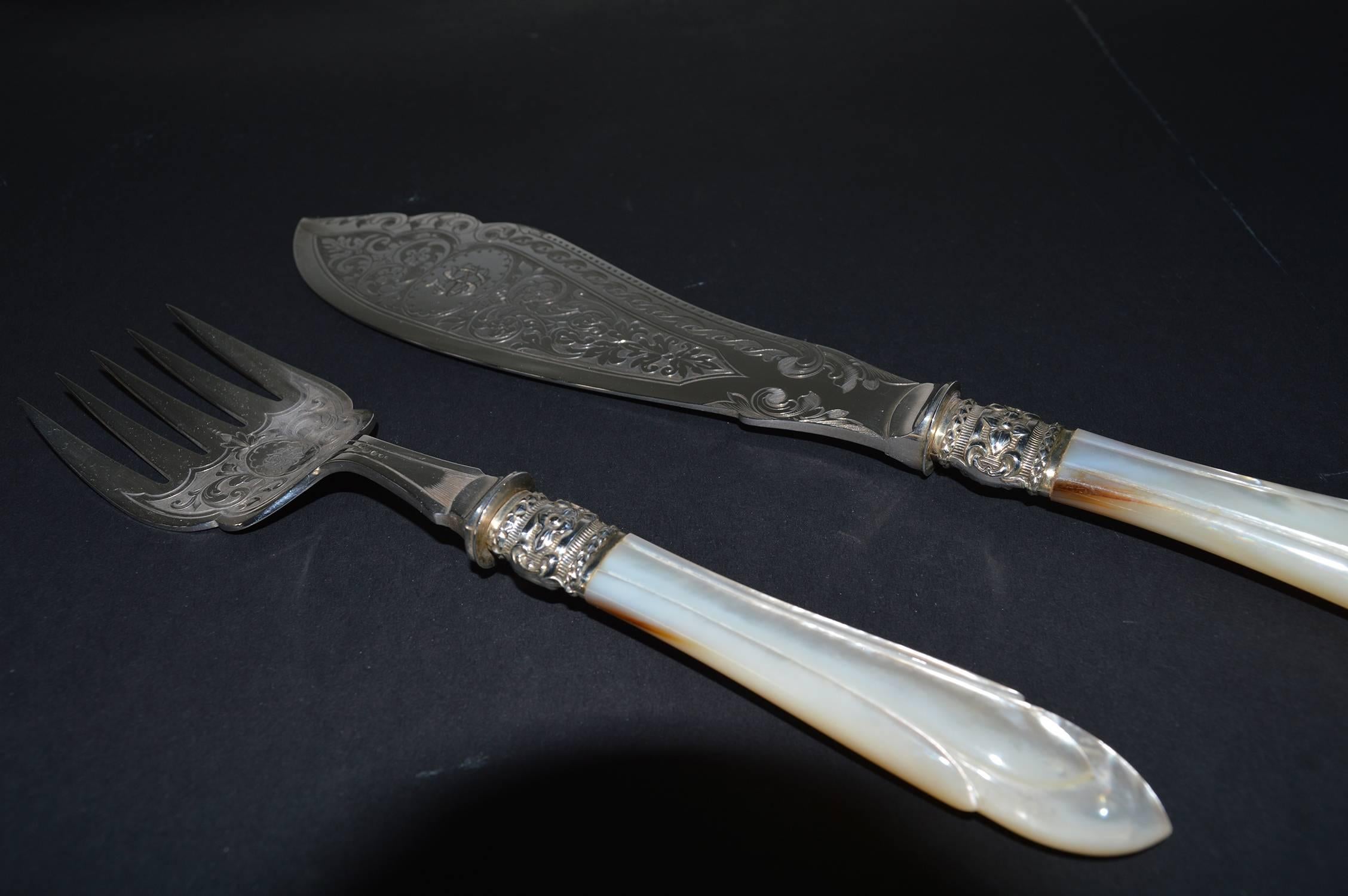 
Exceptional quality fish servers.

Carved mother-of-pearl and the finest engraving on the metal parts.

Beautiful ownership initials engraved on both pieces.

Sheffield maker of L.B. & S marked on the back of the knife.

The measurements