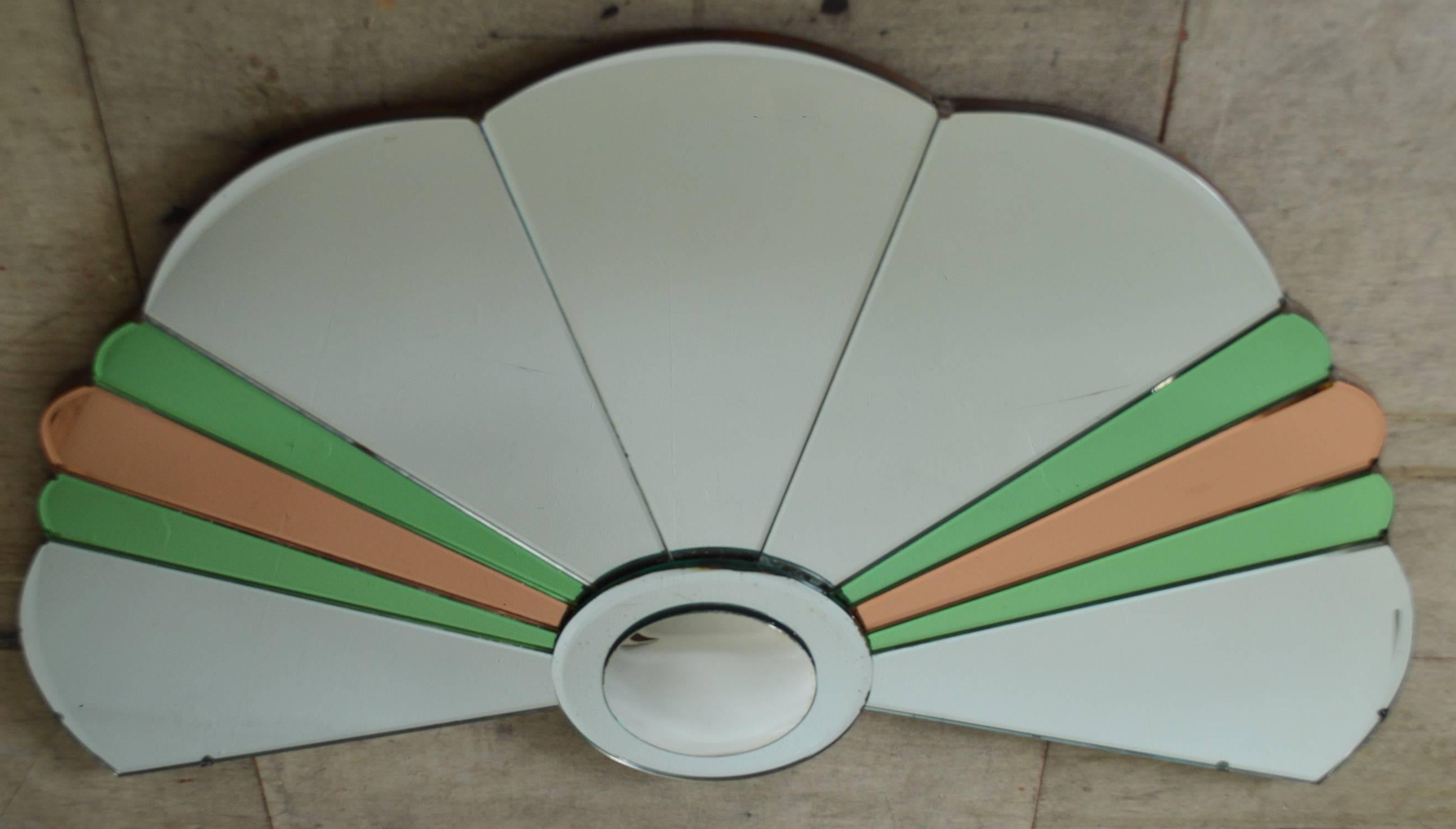 
Fabulous shape of Art Deco mirror. With green and peach glass pieces and also a convex mirror at the bottom.

Finely beveled

Completely original. Not re-silvered. No chips to the glass.