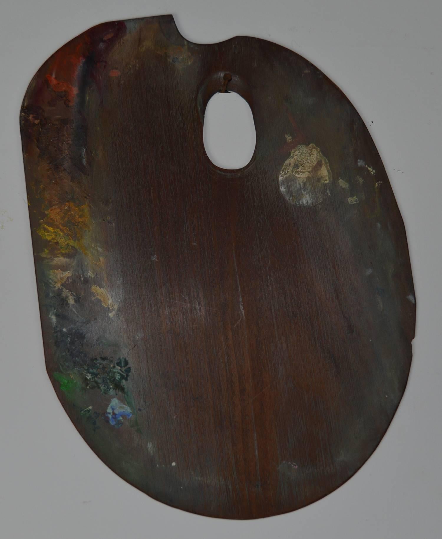 Beautiful and tactile handcrafted mahogany artist’s palette.

Slight remnants of delightful colors of oil paint

Through random use It has become an art object in itself.

Historically it has been repaired and there is a tiny chip to the