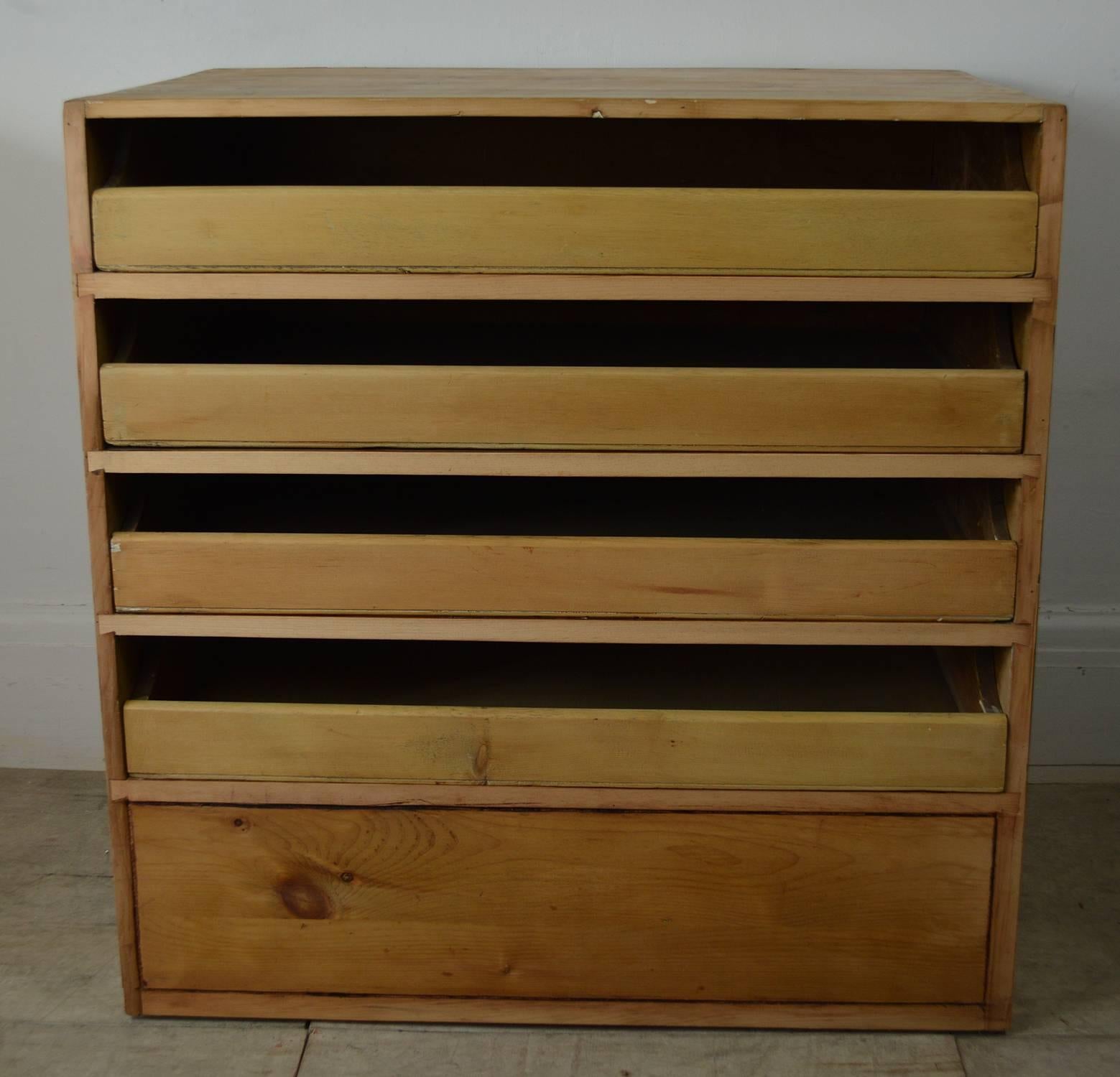 A splendid antique pine plan chest. It has four drawers for charts, folio prints, architectural drawings etc.

Solid pine drawer bottoms. Smooth running drawers.

The very bottom apparent drawer is a dummy drawer.

There have been some recent