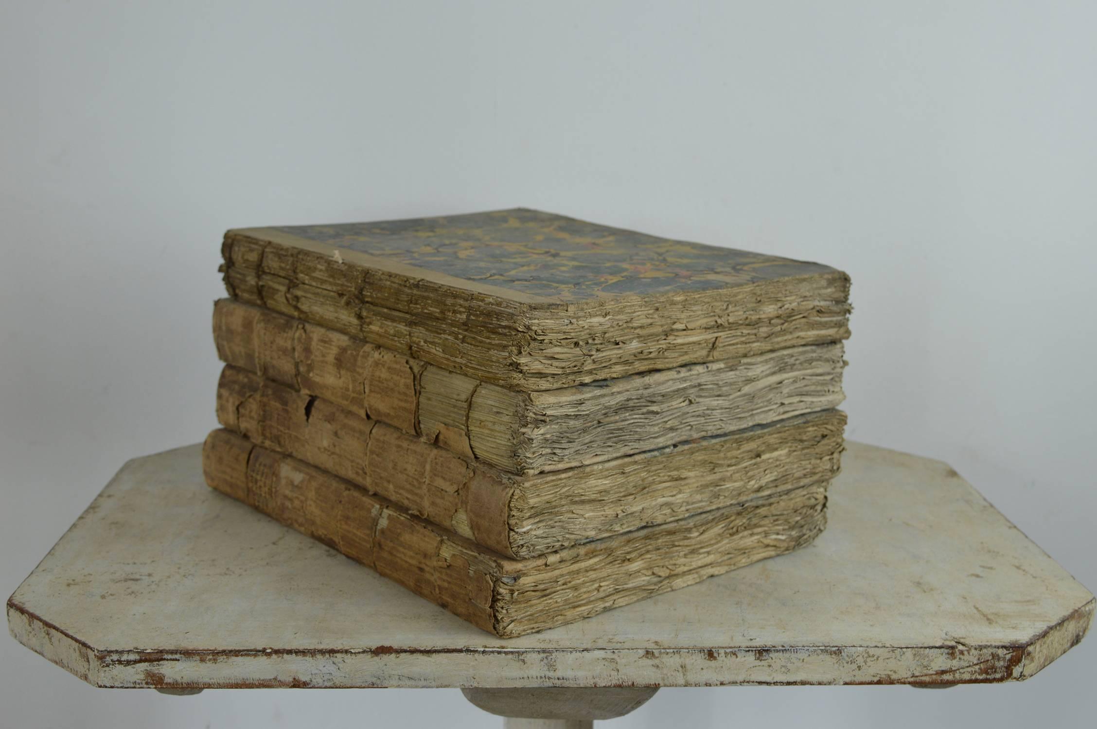 
Wonderfully distressed books with marbleized boards and equally beautiful fore edges.

They are volumes of The Encyclopaedia Britannica, 1797.

I have randomly split them into sets of 4. There are 7 units, a total of 28 volumes.

The price