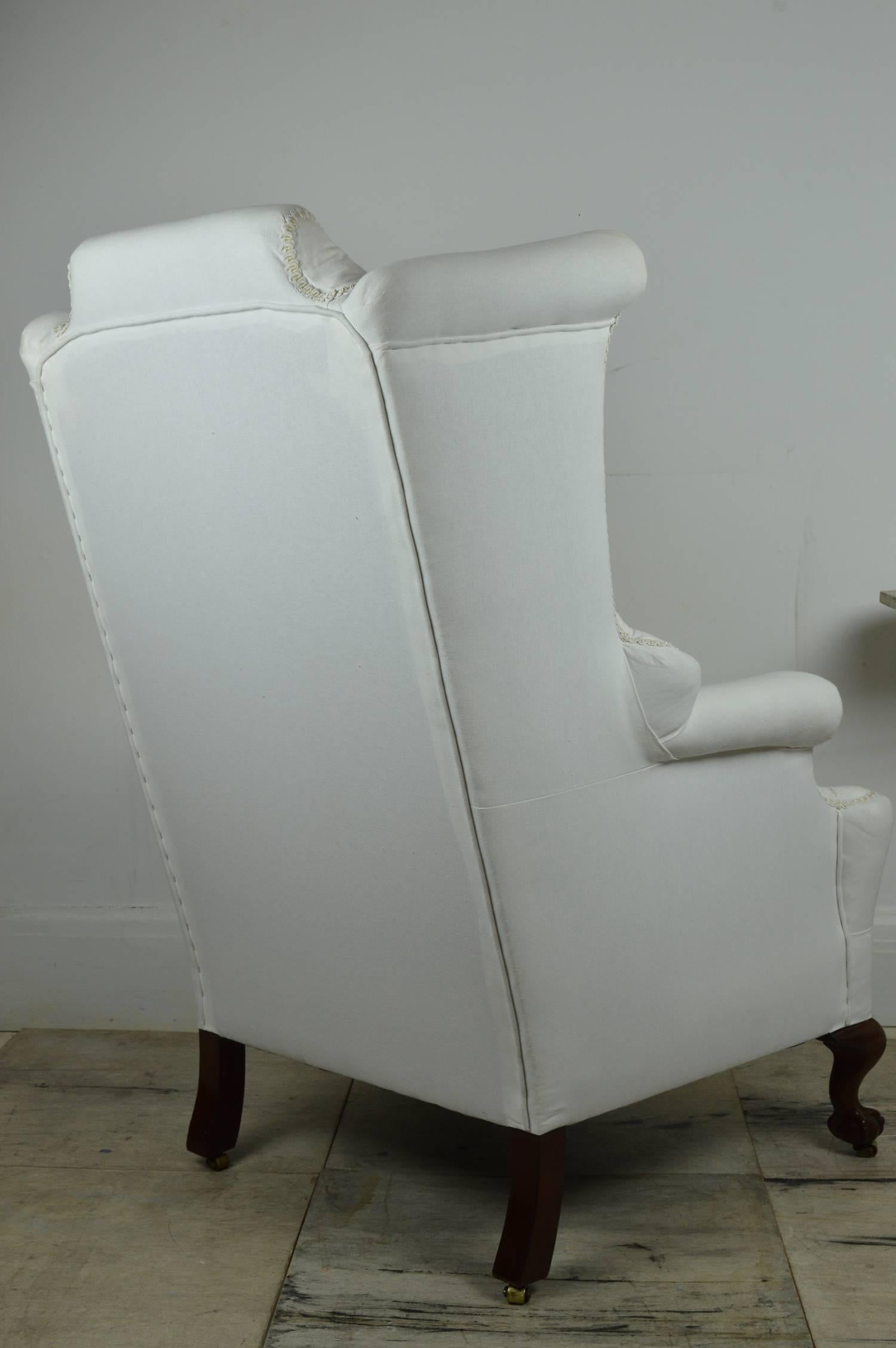 Carved Pair of Antique Georgian Style Wingback Chairs with Mahogany Claw and Ball Feet
