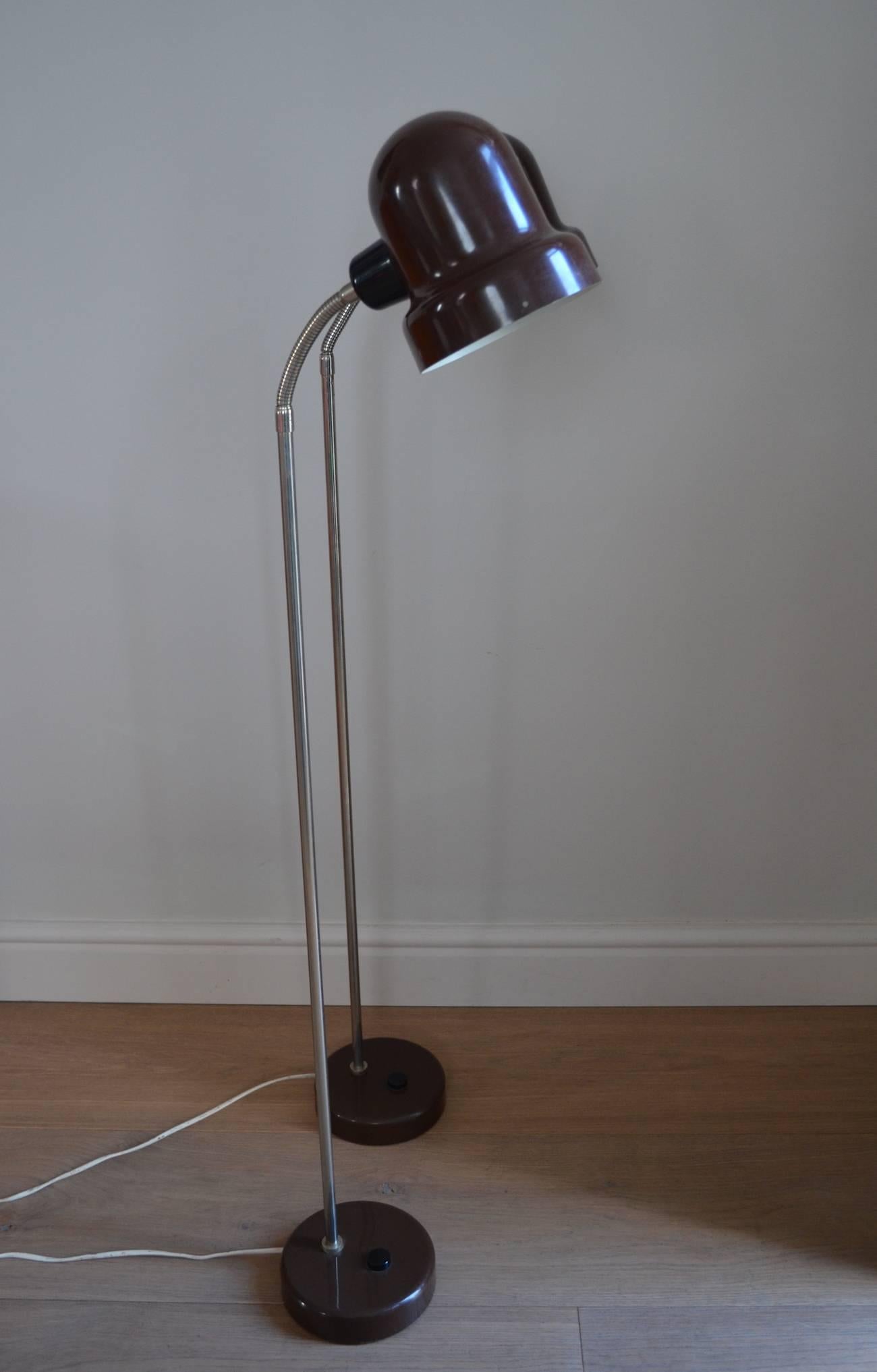 A stylish pair of 1960s brown enamelled steel and chrome adjustable floor reading lamps.