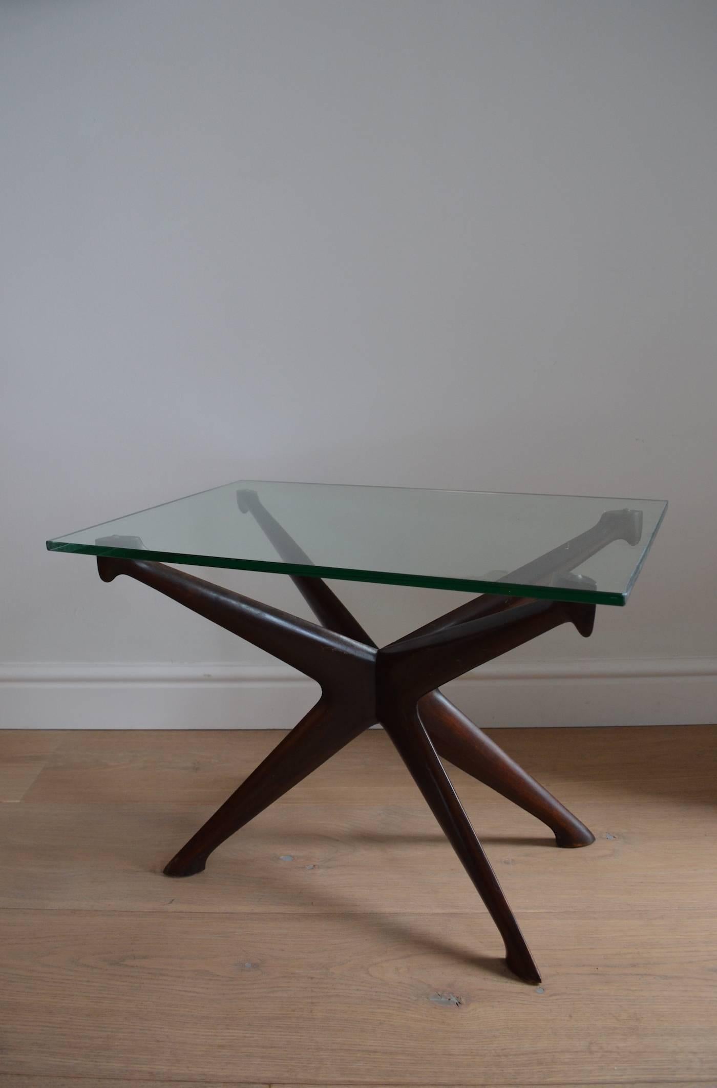 Designed by Ico Parisi for Fratelli Rizzi, this mahogany and glass side table has all the flair and design quality that you'd expect from 1950s Italian design.