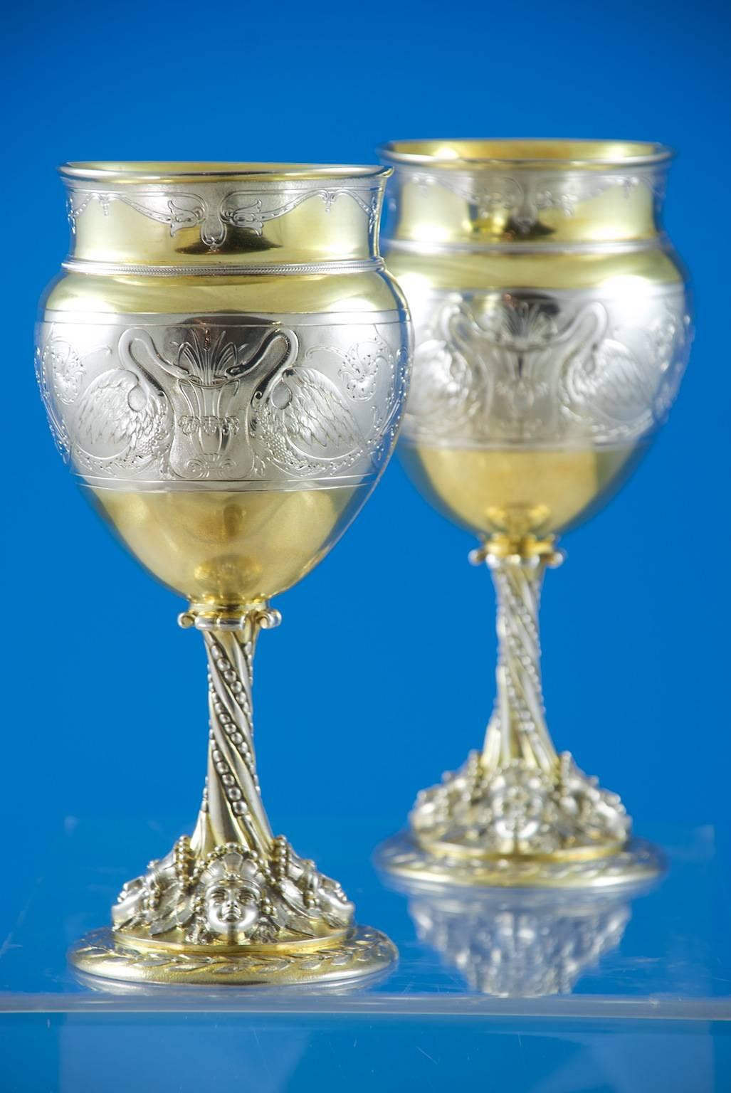 
Elkington, Birmingham 1868.

The ewer: 9 1/4 inches (23.5cm) high.
The goblets: 8 1/2 inches (21.5cm) high.

66oz. (2055g).