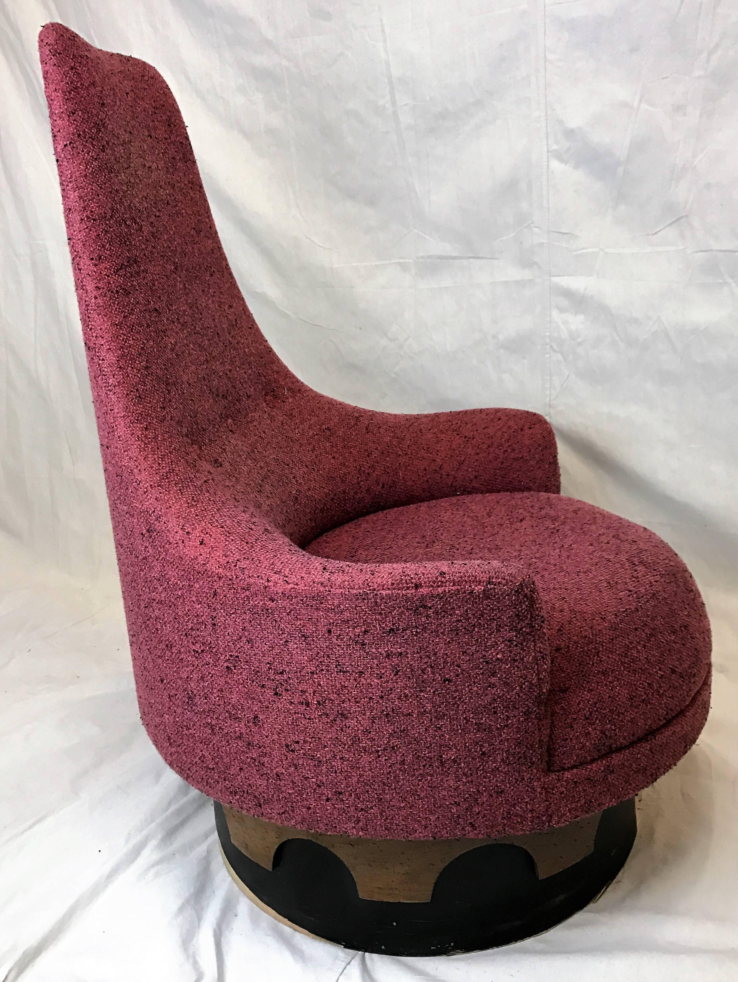 High-back swivel lounge chair by Adrian Pearsall for his “Strictly Spanish” collection for Craft Associates. Original fuchsia tweed upholstery and plinth base featuring two-toned design rotates 360 degrees.