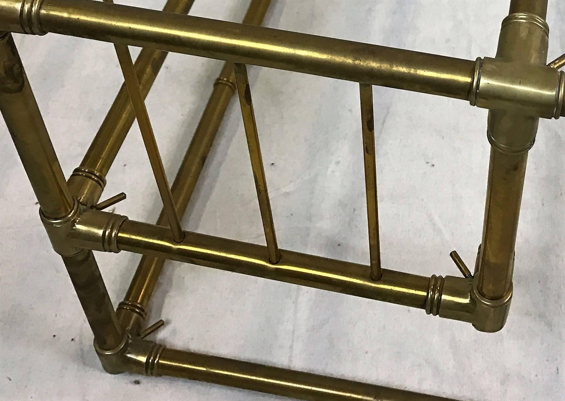 Lovely bamboo and brass Italian cocktail table frame without glass top and lower shelf. A storage area or magazine rack sits on one end. some dents. 