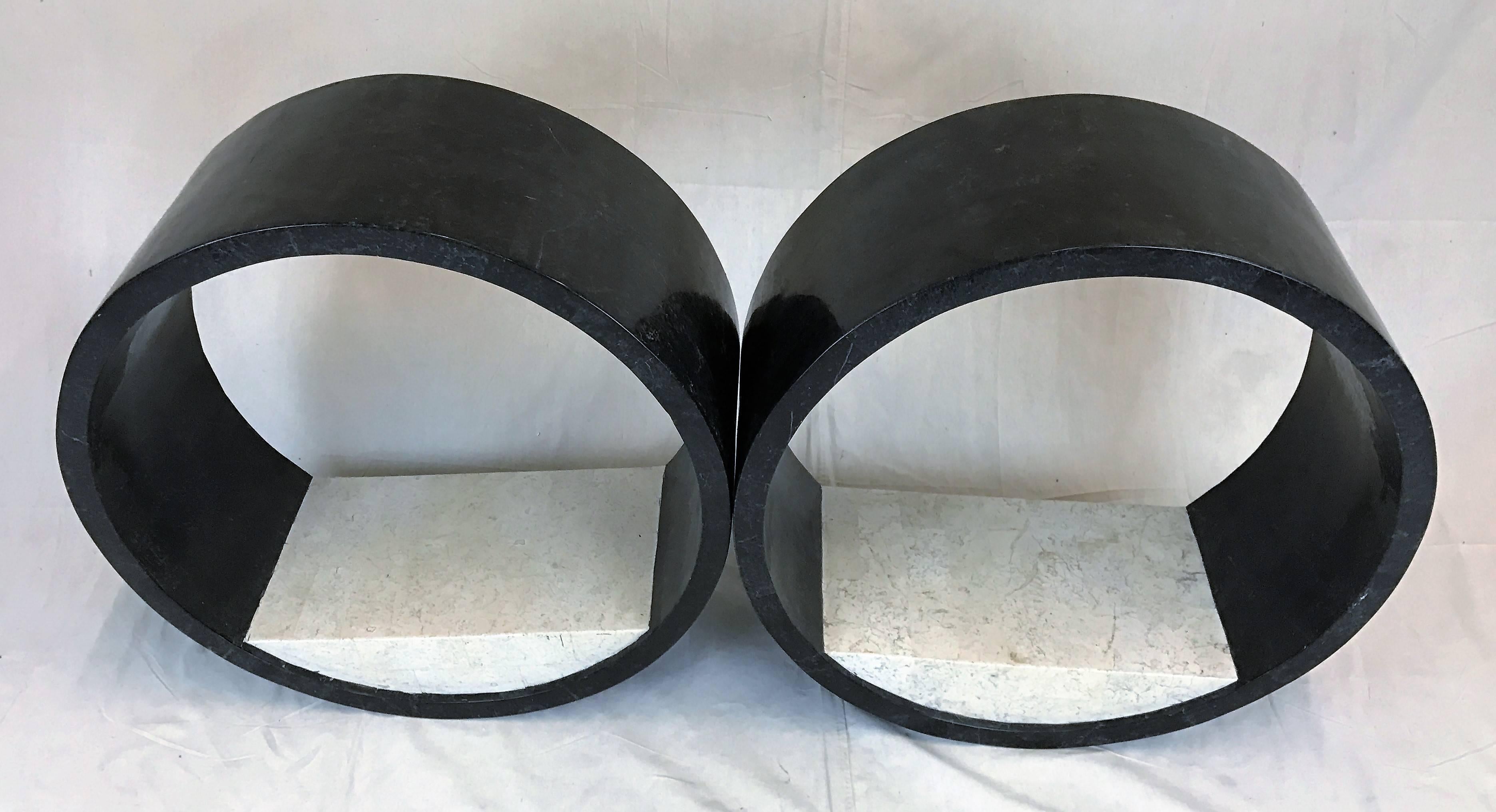 Lovely rare tessellated round shelving from the Marquis Collection of Beverly Hills. The circular black and white stone provides a modern movement to display curios. The Marquis collection is made from 100% natural stones painstakingly hand cut