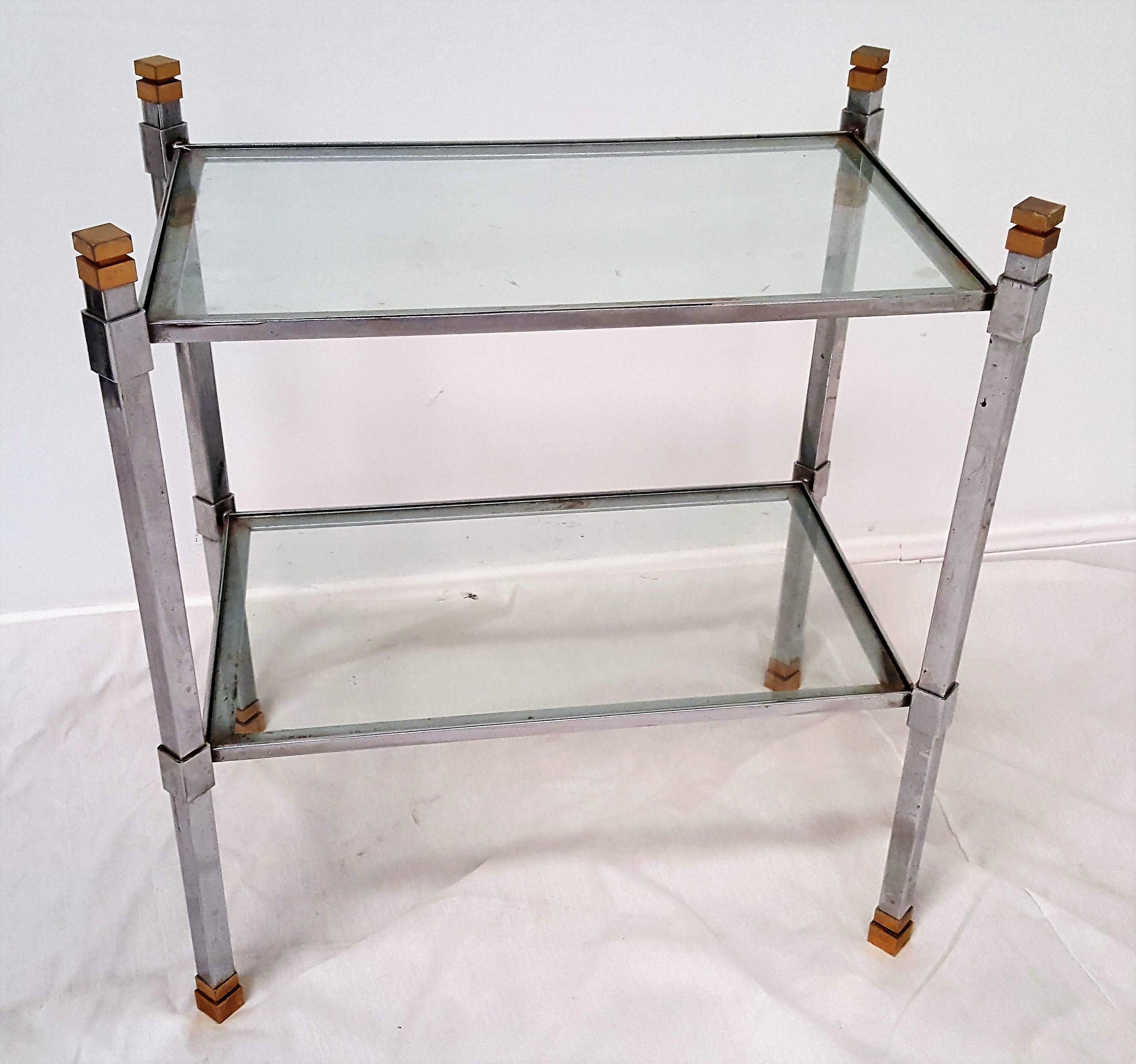 Stylish Italian accent tables perfect for the Mid-Century modern home are attributed to 20th century designer Romeo Rega. Featuring chrome legs and h-stretchers, the four-sided legs include brass top and feet covers. Glass measures 21 inches.
  