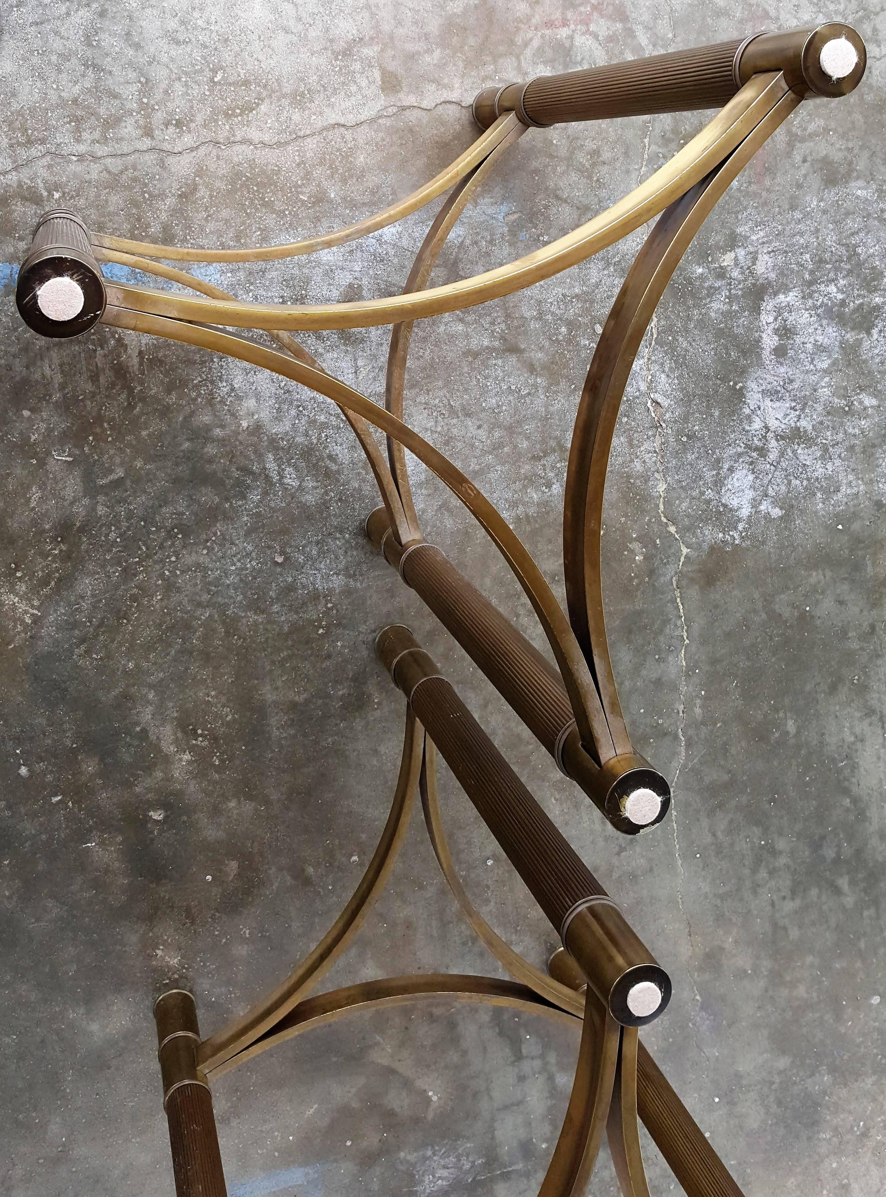 Lovely mastercraft brass triangular dining table bases. Flat stretchers join the reeded legs.