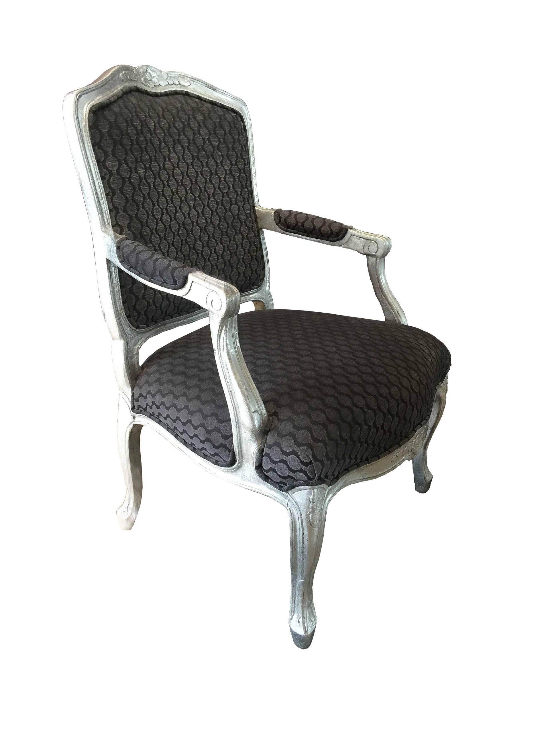 Fauteuils chairs, from the 1960s, have an aluminum leaf and diamond dust finish with Clark & Clark fabric. The curved back and cabriolet legs of the fauteuils were fashionable in the 18th century.  Please note, the fabric is is in great shape, the