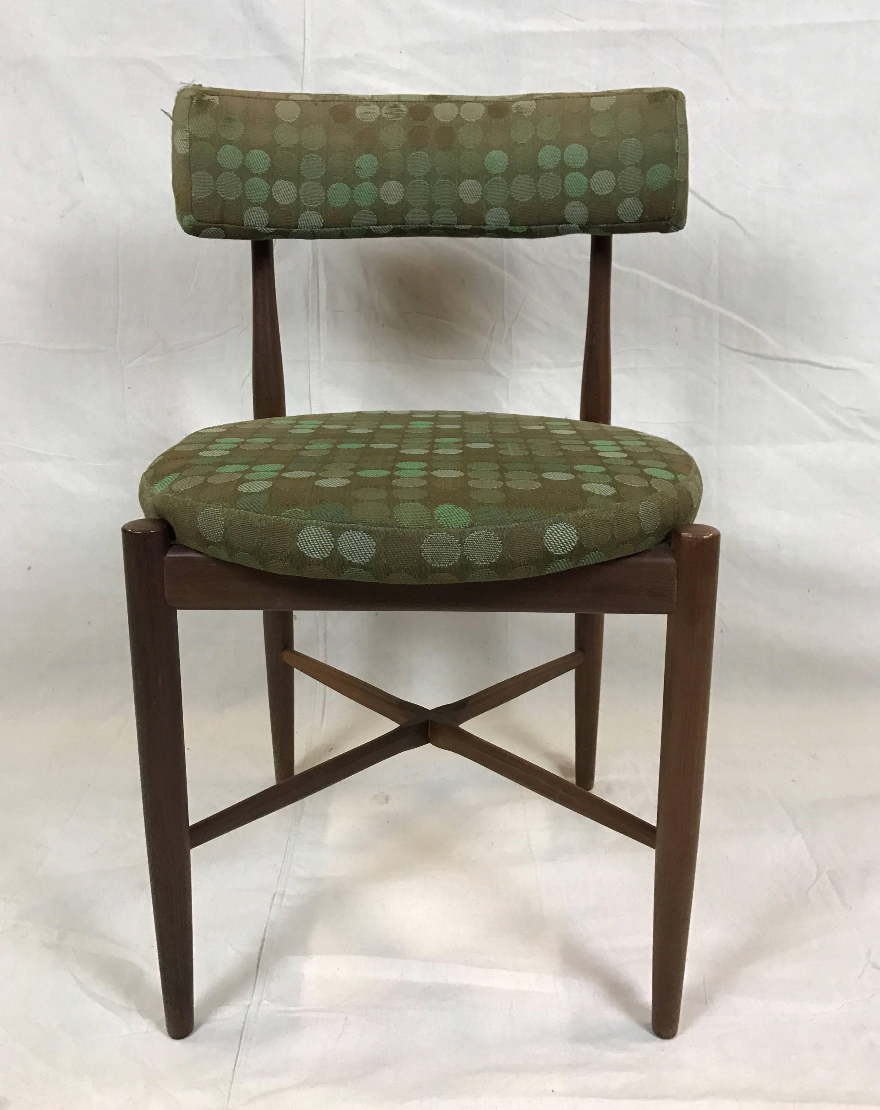 Beautifully simple Danish g-plan teak dining chairs with the distinguishable Kofod Larsen round. Round seat width 18in.