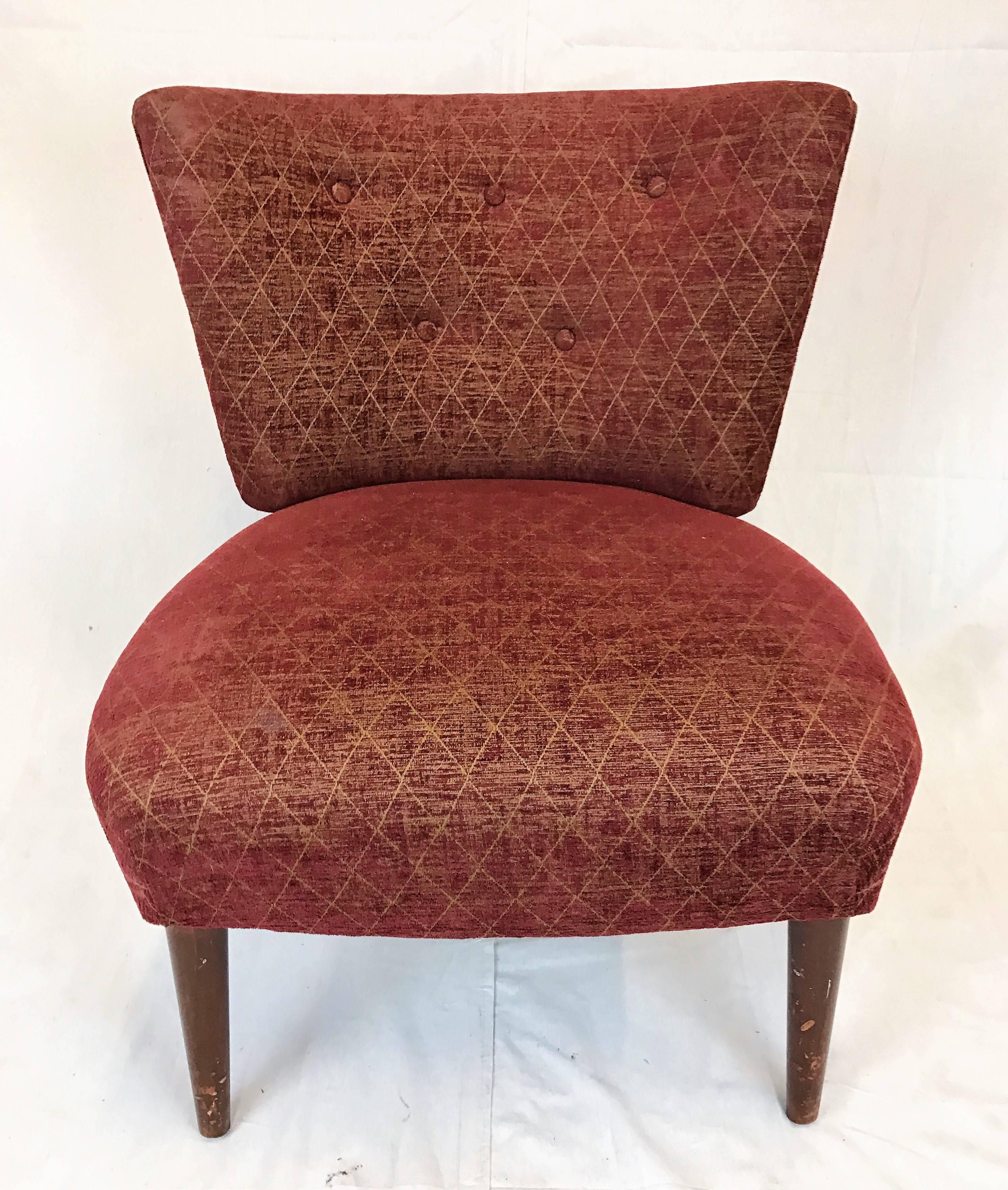 Elegant pair of slipper chairs attributed to Gilbert Rohde (1894-1944), for Kroehler Manufacturing early 1940s. The full “pouf” seat found on Rohde’s designs sits atop tapered walnut legs. Buttoned backrest and piping add to the chairs glamour.