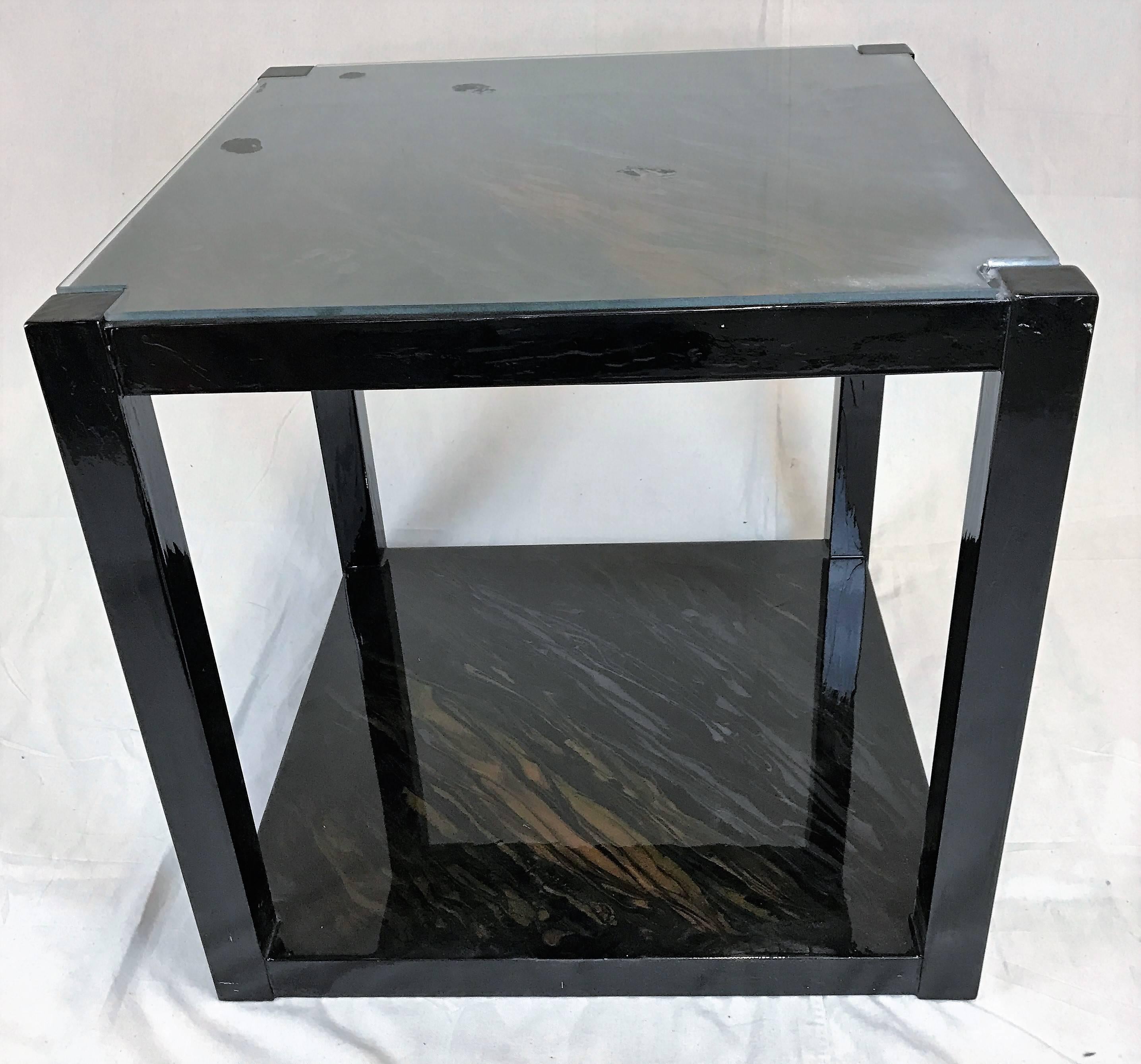 William Loyd, a Houston, Texas artist, creates each object he works with into a stunning piece of art. These lacquered tables are no different. While the tables appear black, upon closer look the brilliant colors used come through in the finish.