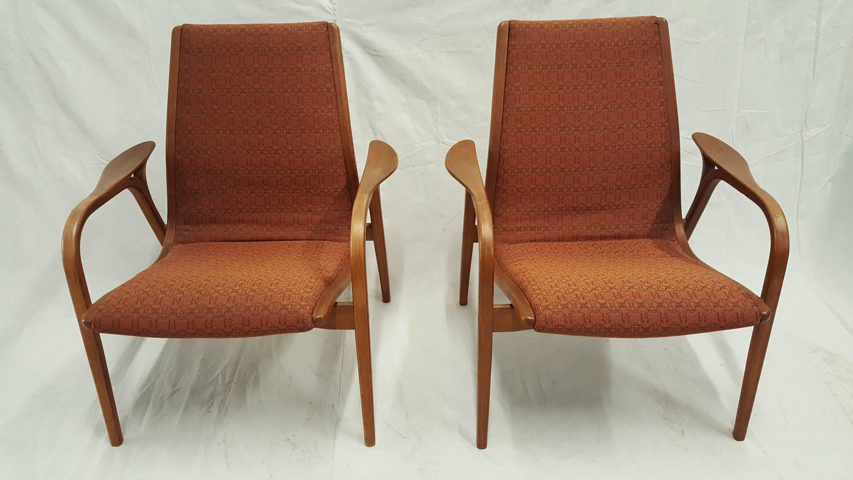 Pair of Swedish wood and fabric lounge chair designed by Yngve Ekstrom in the 1960s.  All original.