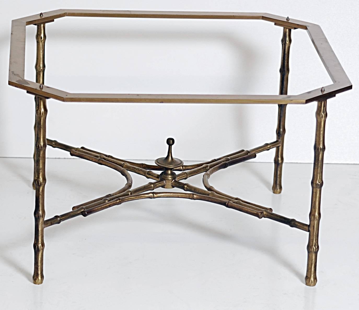 Bronze bamboo form base coffee table with a plate glass top.