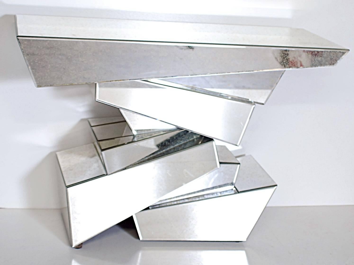 Outstanding pair of rock form console tables with an antique mirror finish.