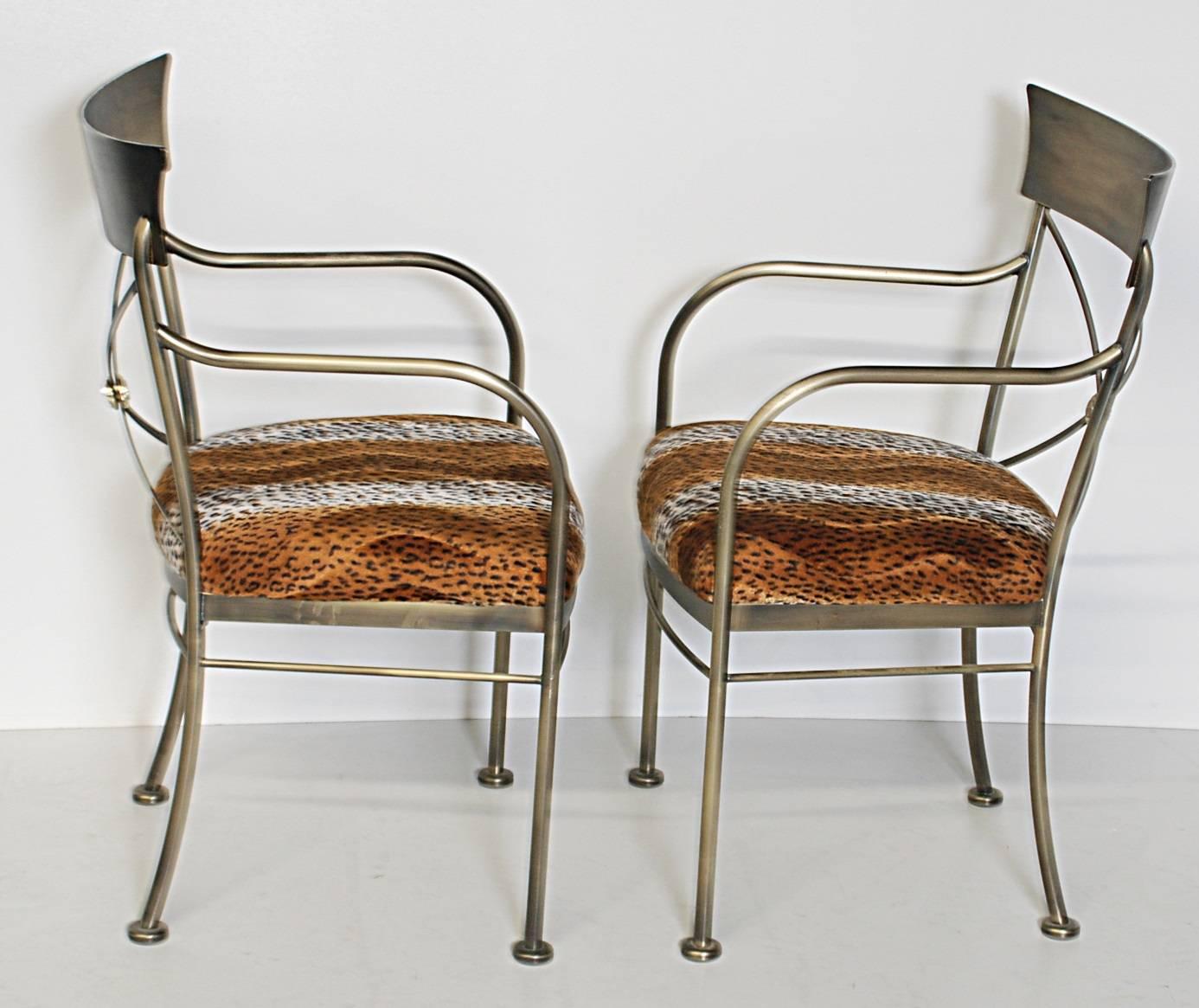 Pair of Directoire style brushed stainless steel side chairs with leopard design upholstery.