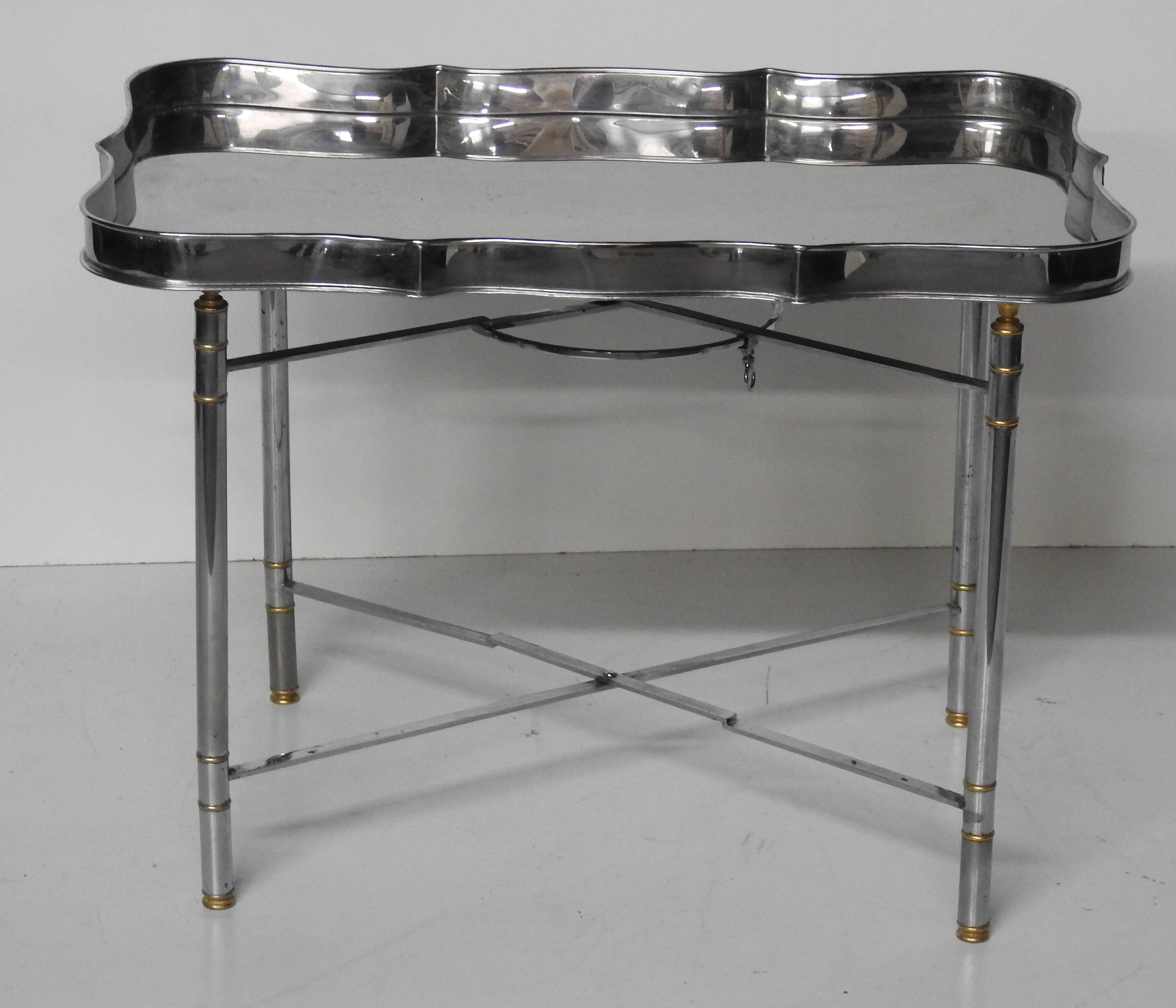 Campaign style stainless steel tray on folding stand.