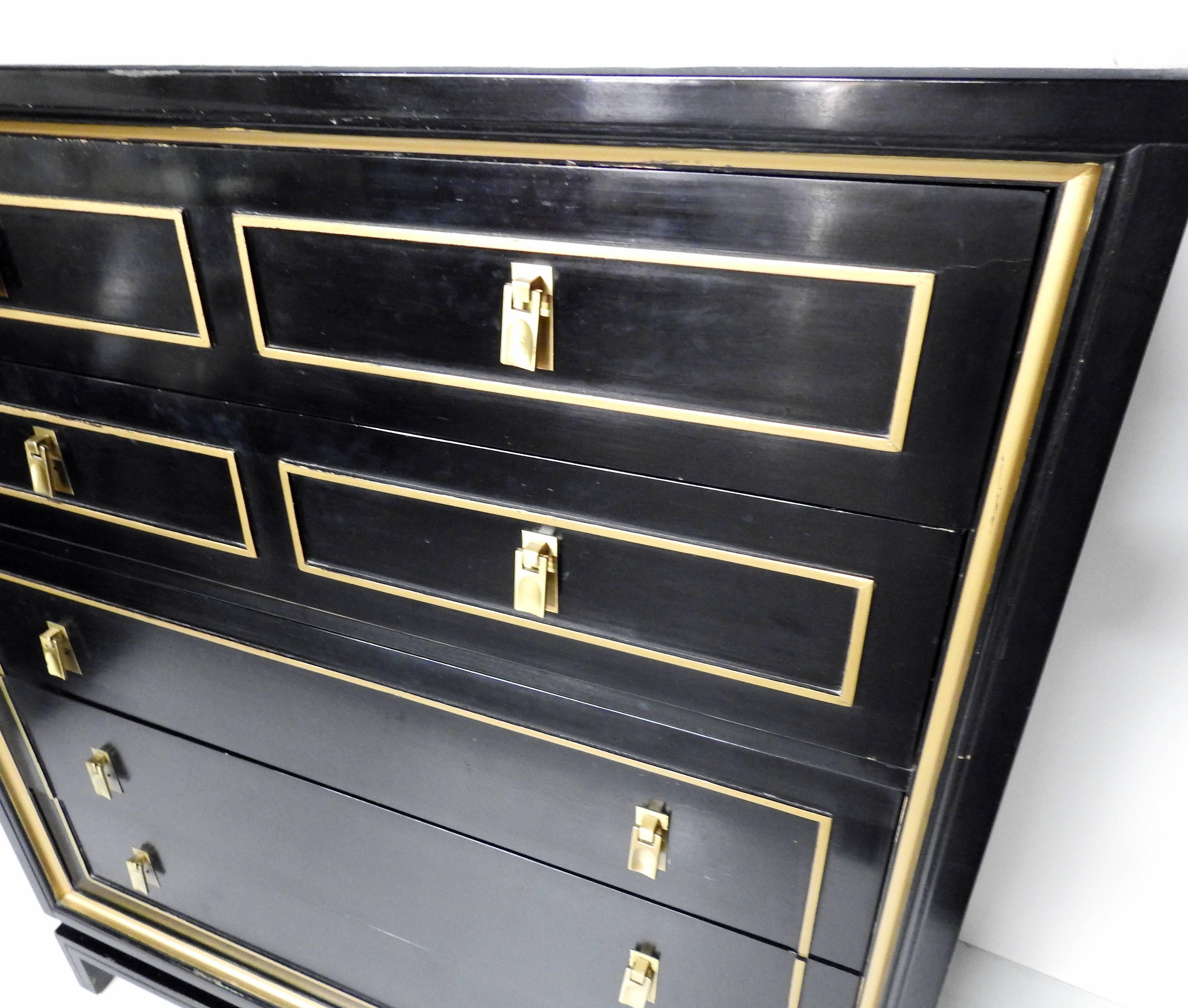 American of Martainsville black lacquer and gilt trim chest of drawers. Three of the five drawers are separated into two sections.