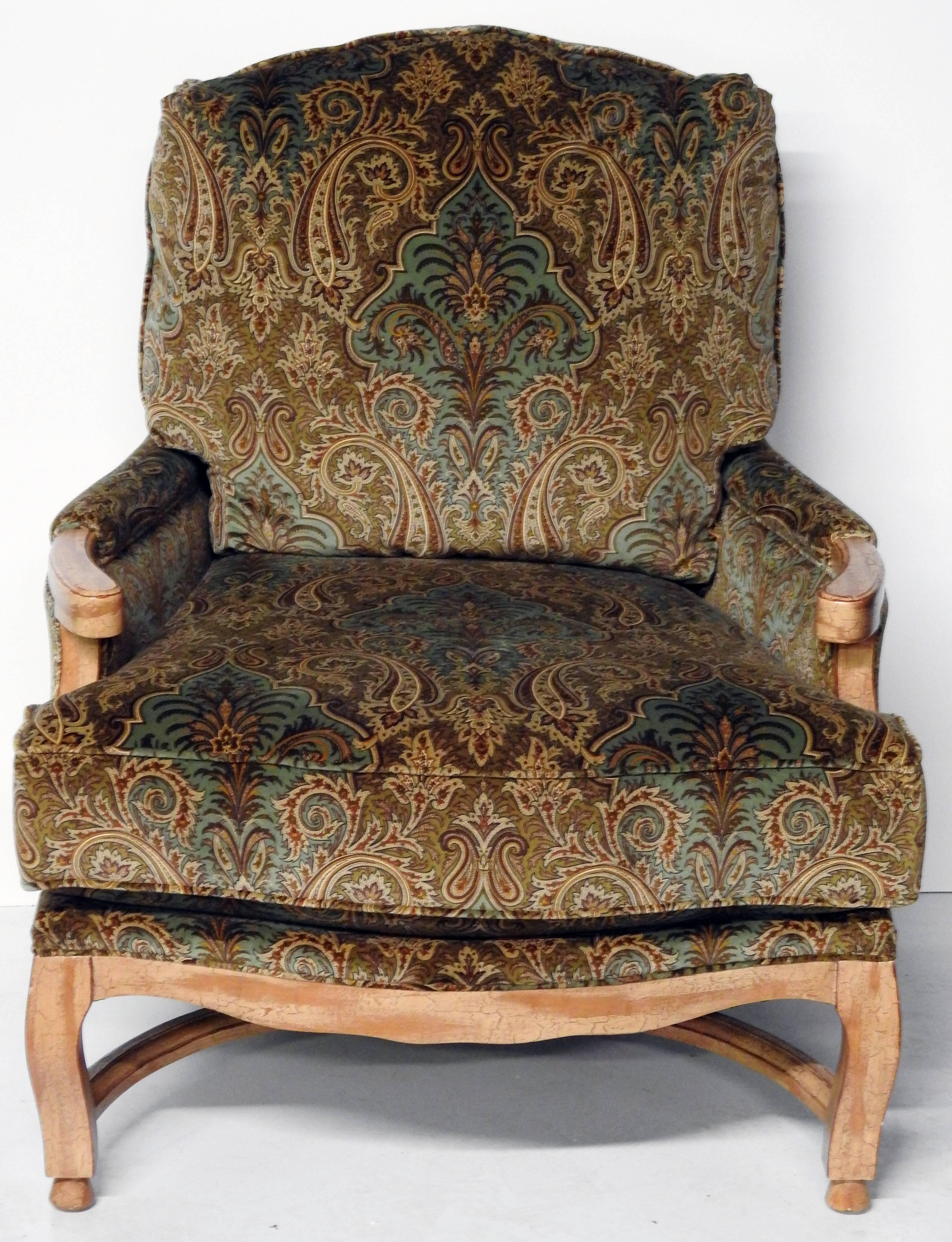 Large painted wood, paisley cut velvet upholstered bergere and ottoman. Although there is no manufacturer displayed on the label, the California registration number belongs to Hammer Collection Inc (1997-2015.) Bergere measurements are below. The