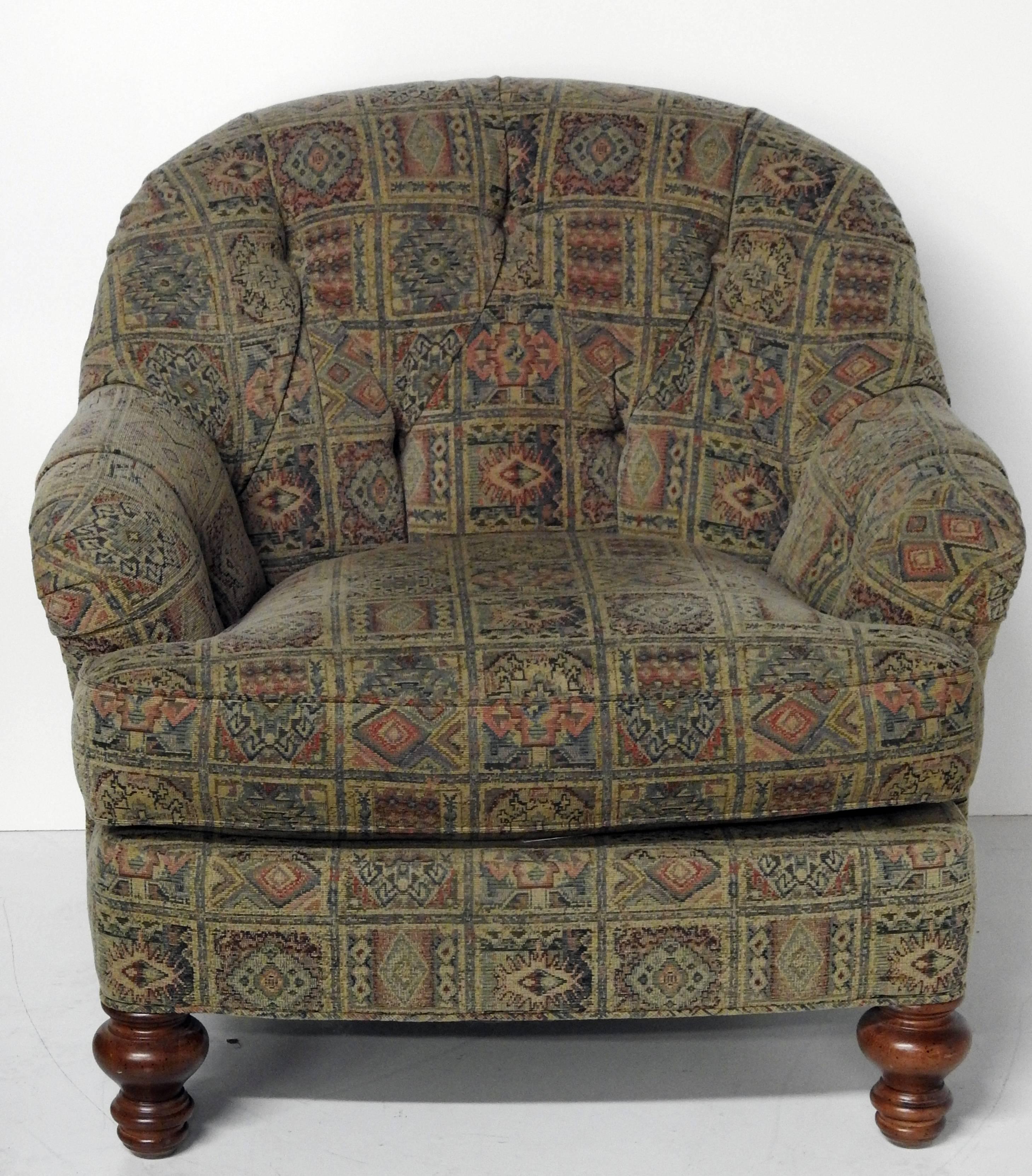 Pair of William IV style club chairs and ottoman with intentionally worn southwestern patterned machined tapestry upholstery on walnut legs by Sherrill. The ottoman measures: 33in W x 34in D x 16in H.
