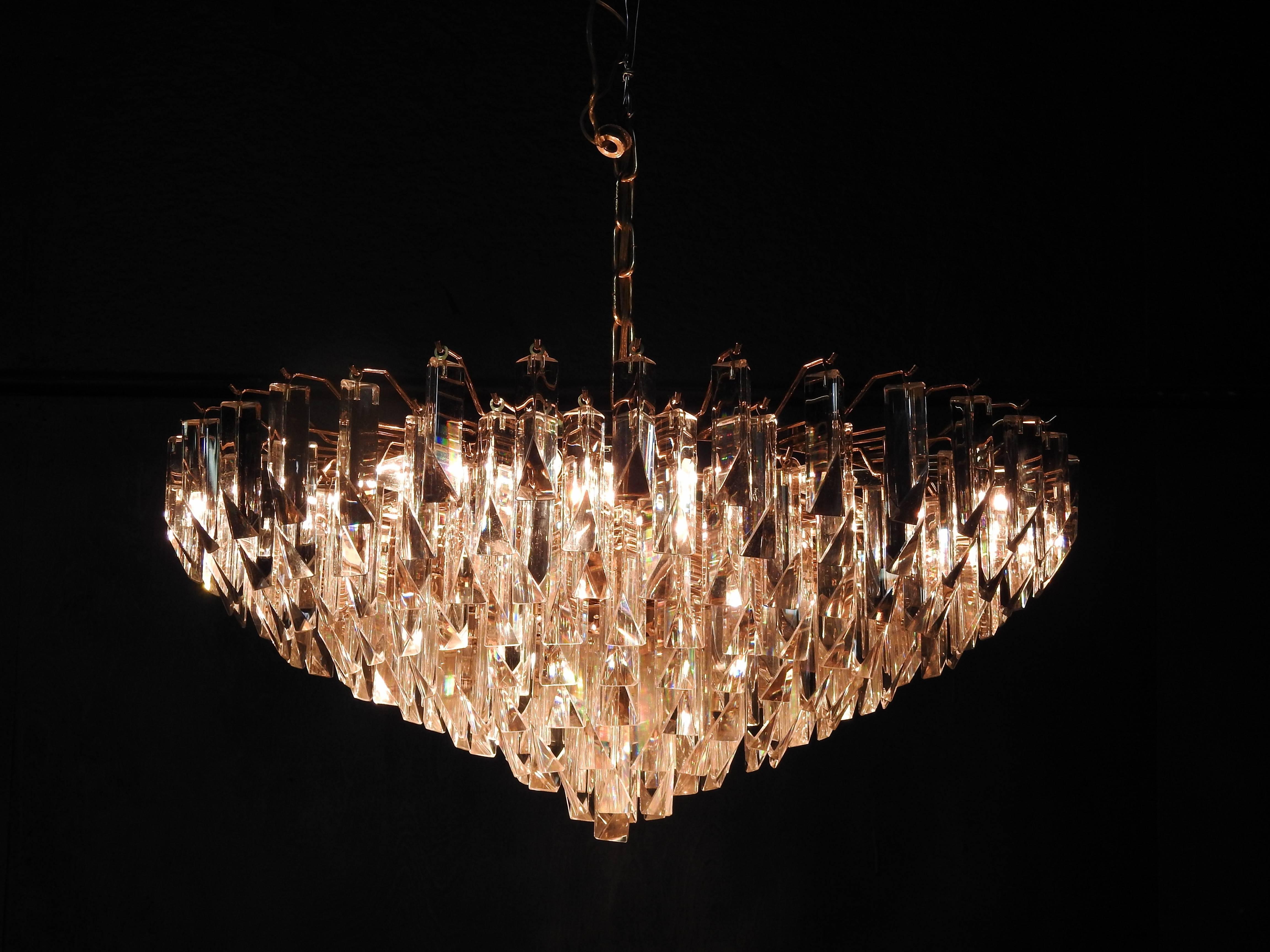 Italian Camer Glass eight-tier, eight-light chandelier with Venini Tiedri crystals, and includes four extra crystals.  The chain is 10