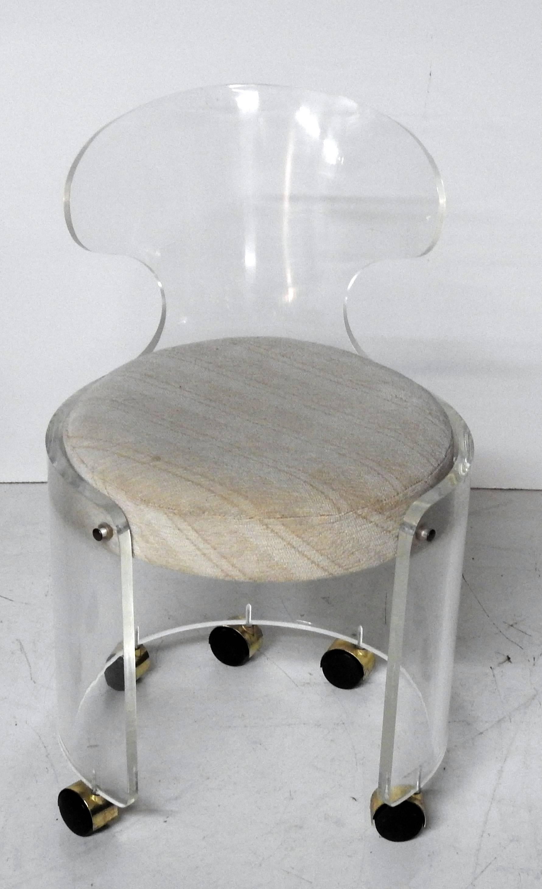 Mid-Century Modern Lucite vanity stool on casters.