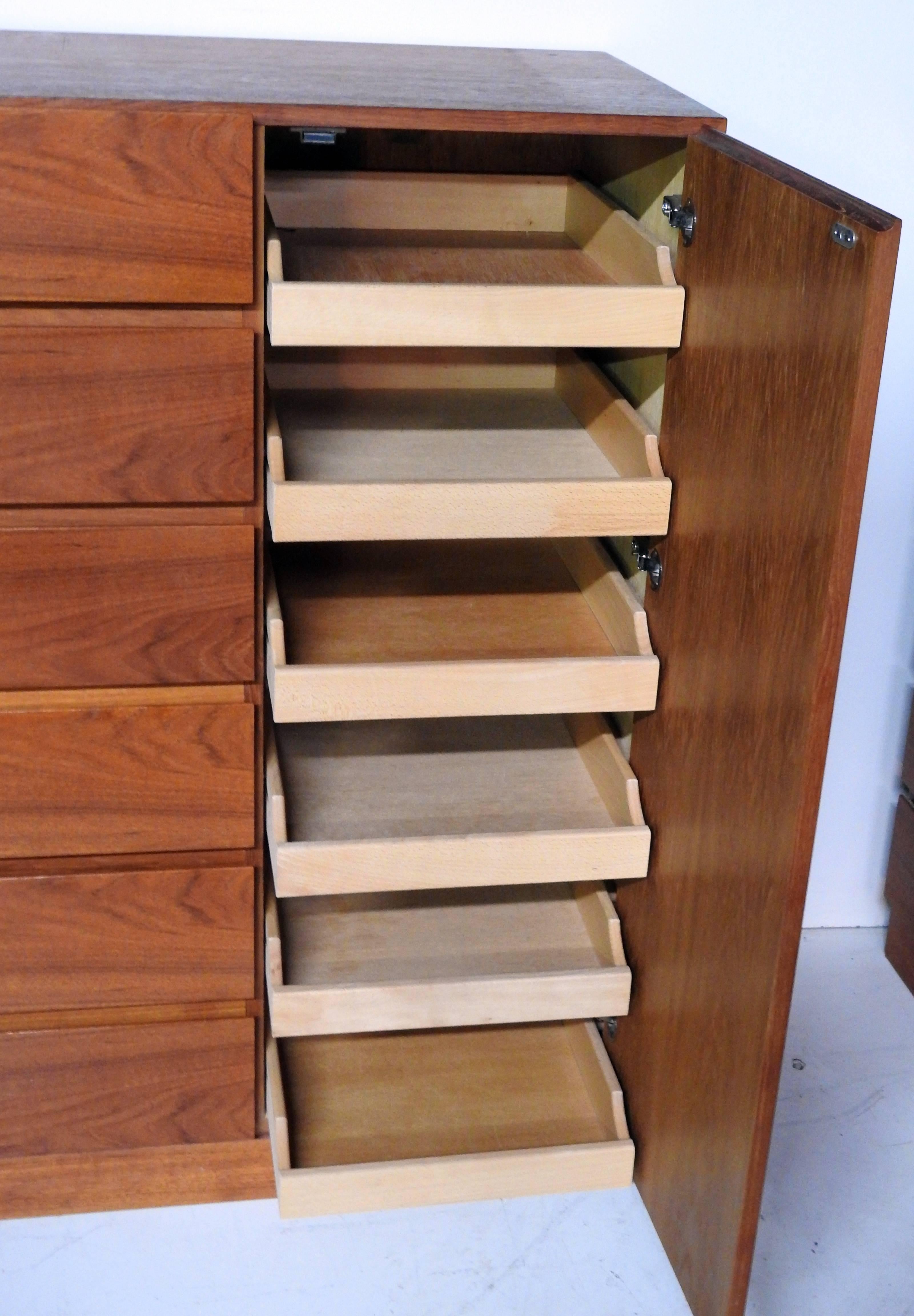 Teak Danish chiffonier by Vinde Mobelfabrik with six drawers and six drawers behind door.