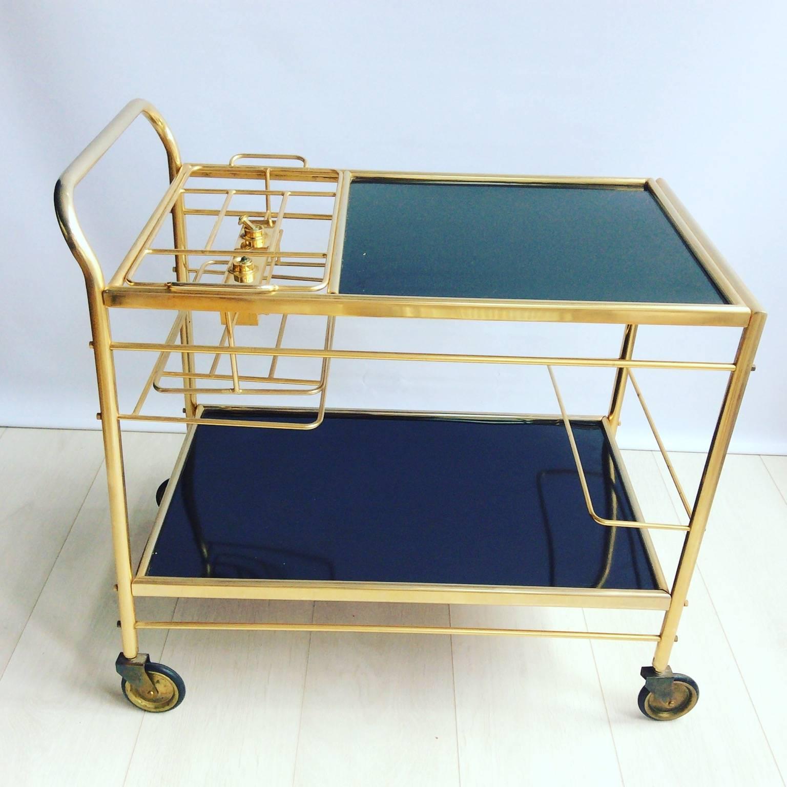 One of a kind. This amazing drinks trolley with a burner (should you require!)

Great condition.

Top tray measures 64cm by 40.5cm and stands 57.5cm tall.