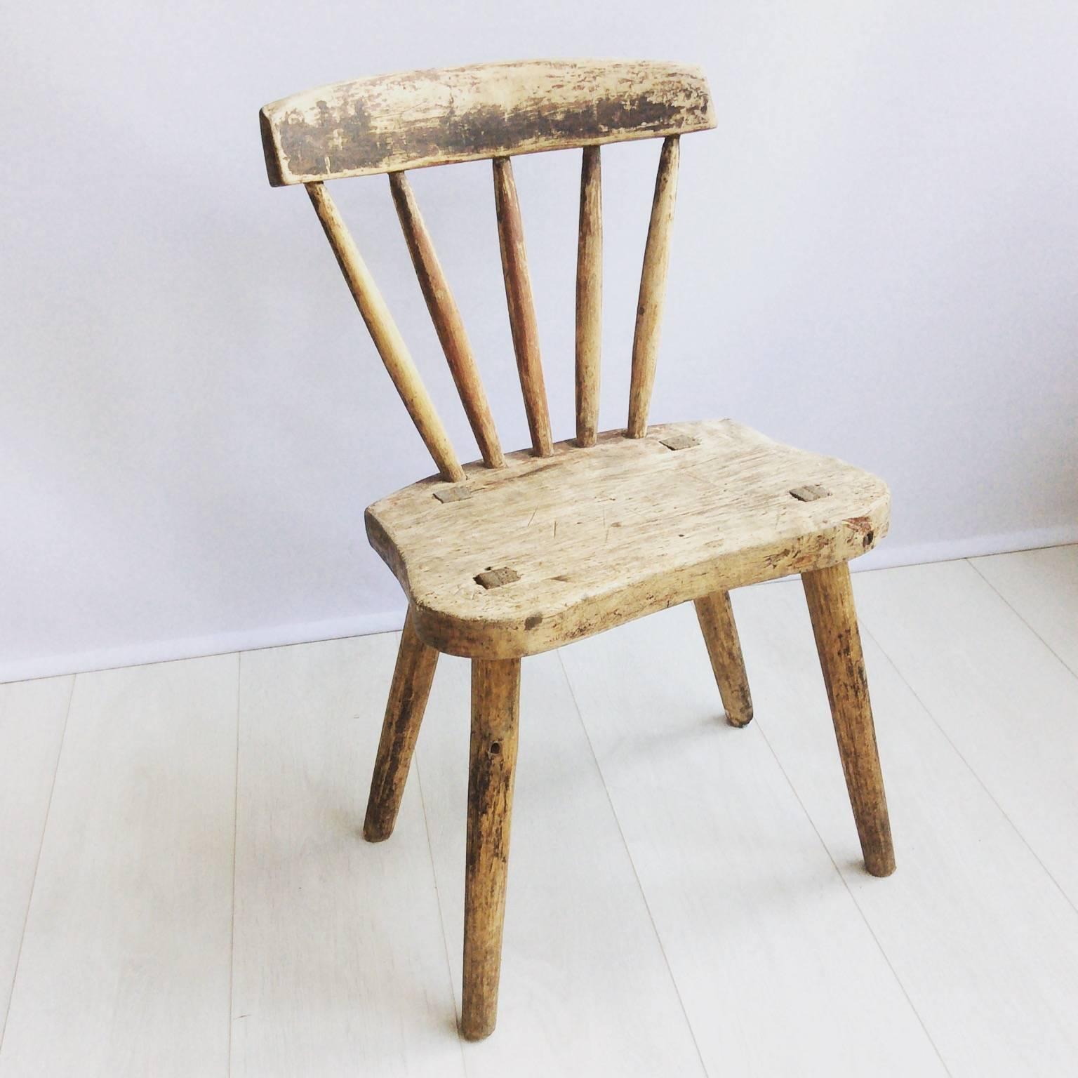 Primitive wooden chair from Dalarna, Sweden, circa 1800.

Great shape with traces of paint, lovely aged patina.
    