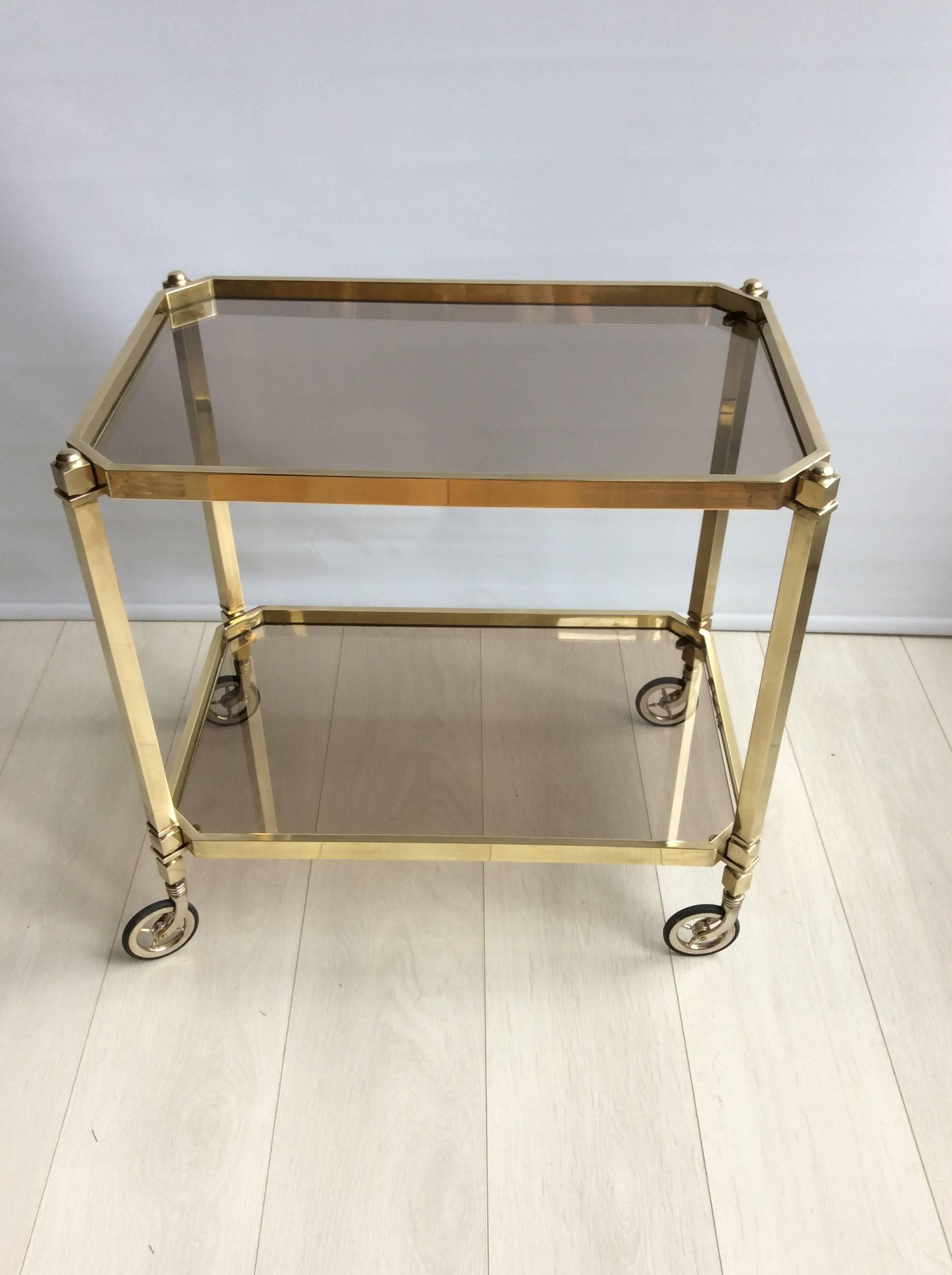 Clean lines, good quality piece with smoked glass trays

Top tray measures 58cm wide, 37cm deep and 56cm tall
Overall dims 59cm wide, 38.5cm deep and 58.5cm tall
