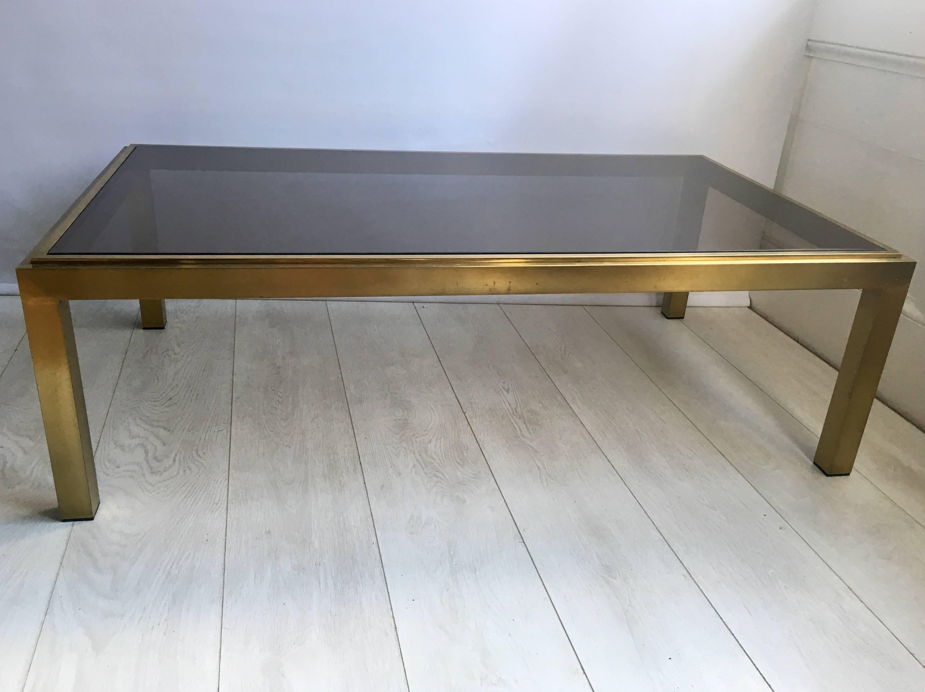 Great looking coffee table with brushed brass frame and smoked glass shelf

French, circa 1970s.